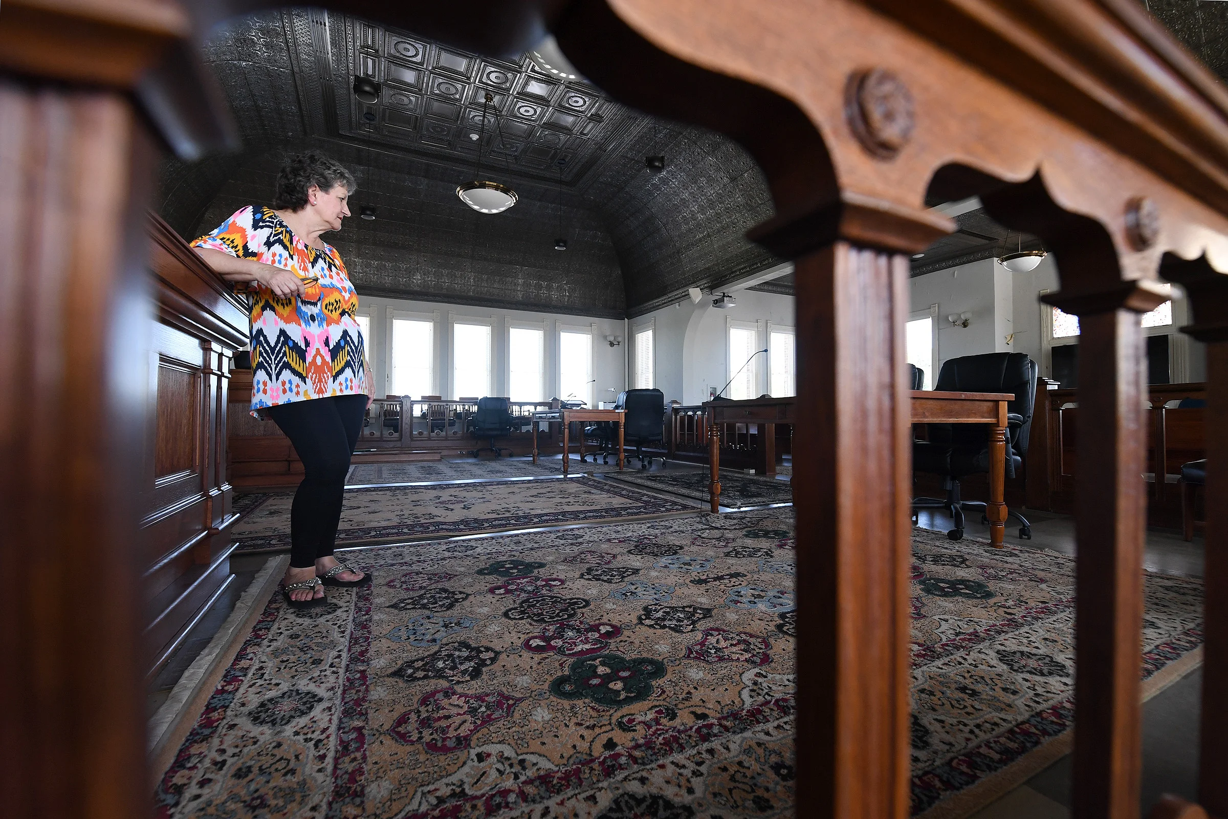 Former Mayor Gail Sowell stands in the courtroom at the Grimes County Courthouse on Thursday, June 13, 2019 ahead of a community event celebrating the courthouse's 125th anniversary in Anderson, Texas. (Laura McKenzie/The Eagle)