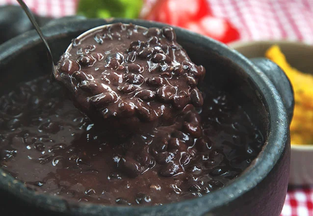 FEIJOADA: Rafinho's sloppy bean stew took approximately 5 hours to make and used all available space in the kitchen. Meanwhile, my noodles took 3 minutes to prepare.