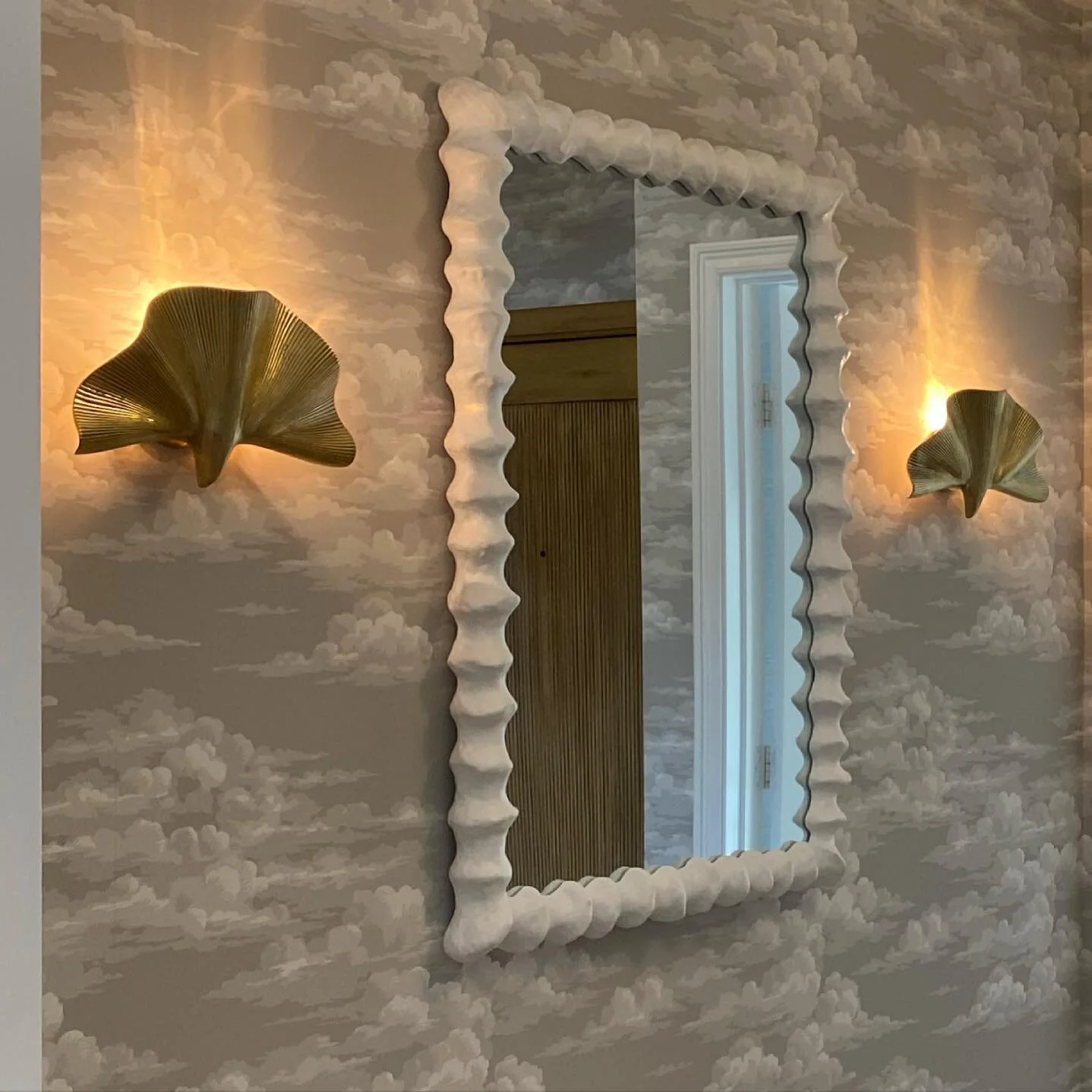 Sneak Peak: Excited about this entry, which transformed the entrance to a warm and dreamy foyer that opens to a grand and open living space.  It sort of feels like Frank Lloyd Wright in his architectural theory (not his aesthetic) - being birthed int