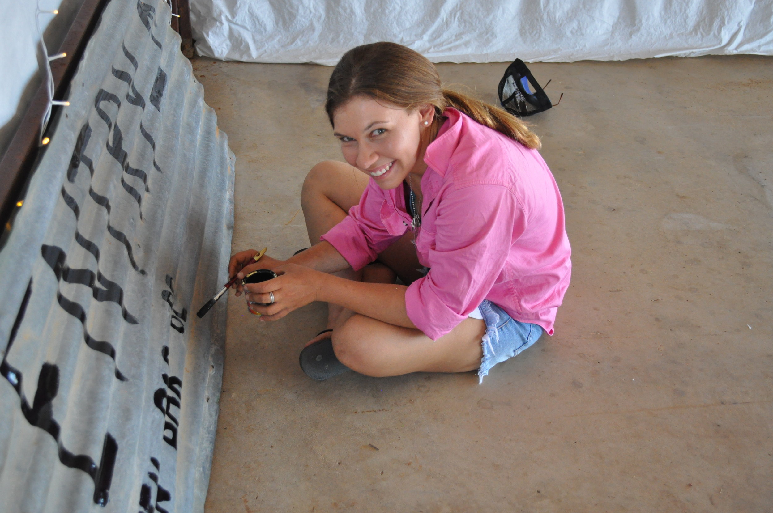 Kate Paterson, painting a sign at YarakaB&S2017.JPG