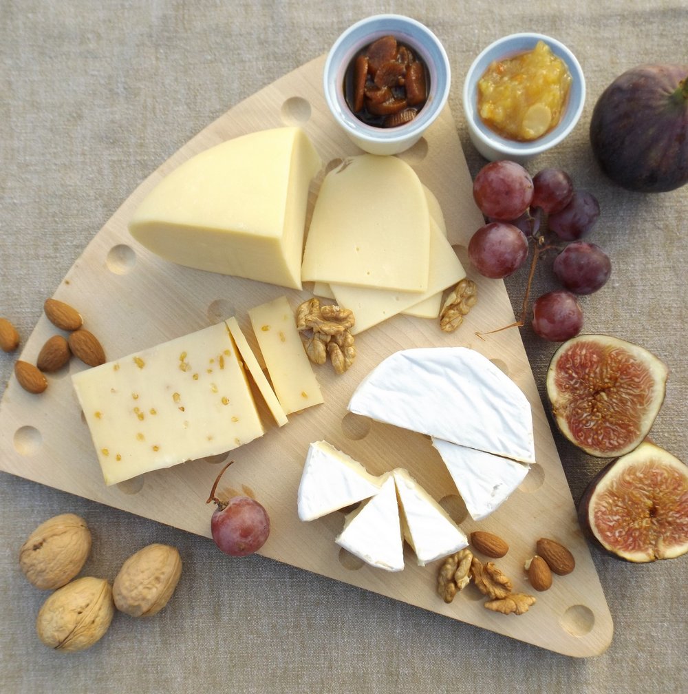Assorted_Cheese_Platter_Served_With_Fruits_Crackers.jpg