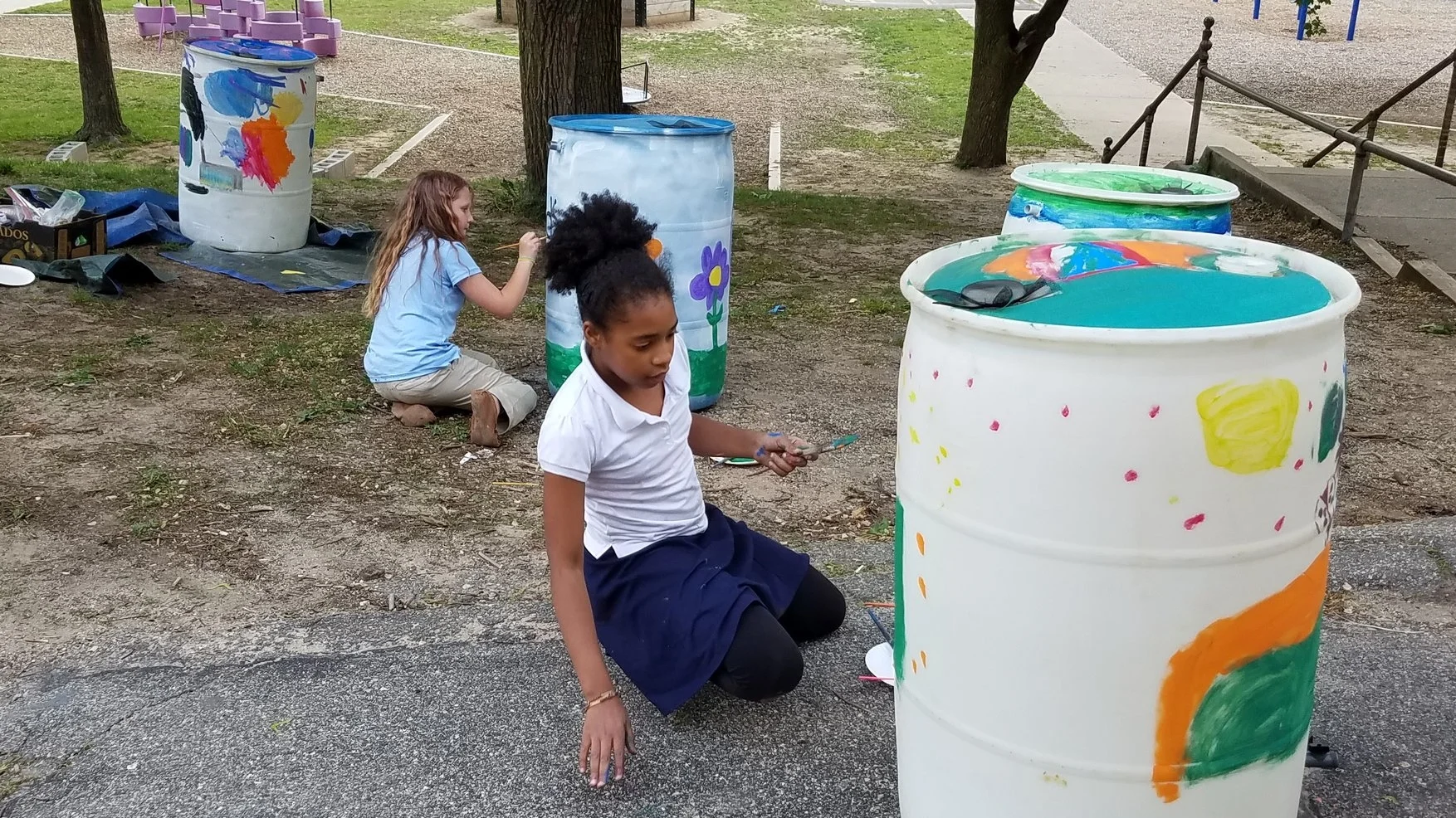 North Park Elementary students painting rain barrels at the GLRI Rain Barrel Workshop May 2017