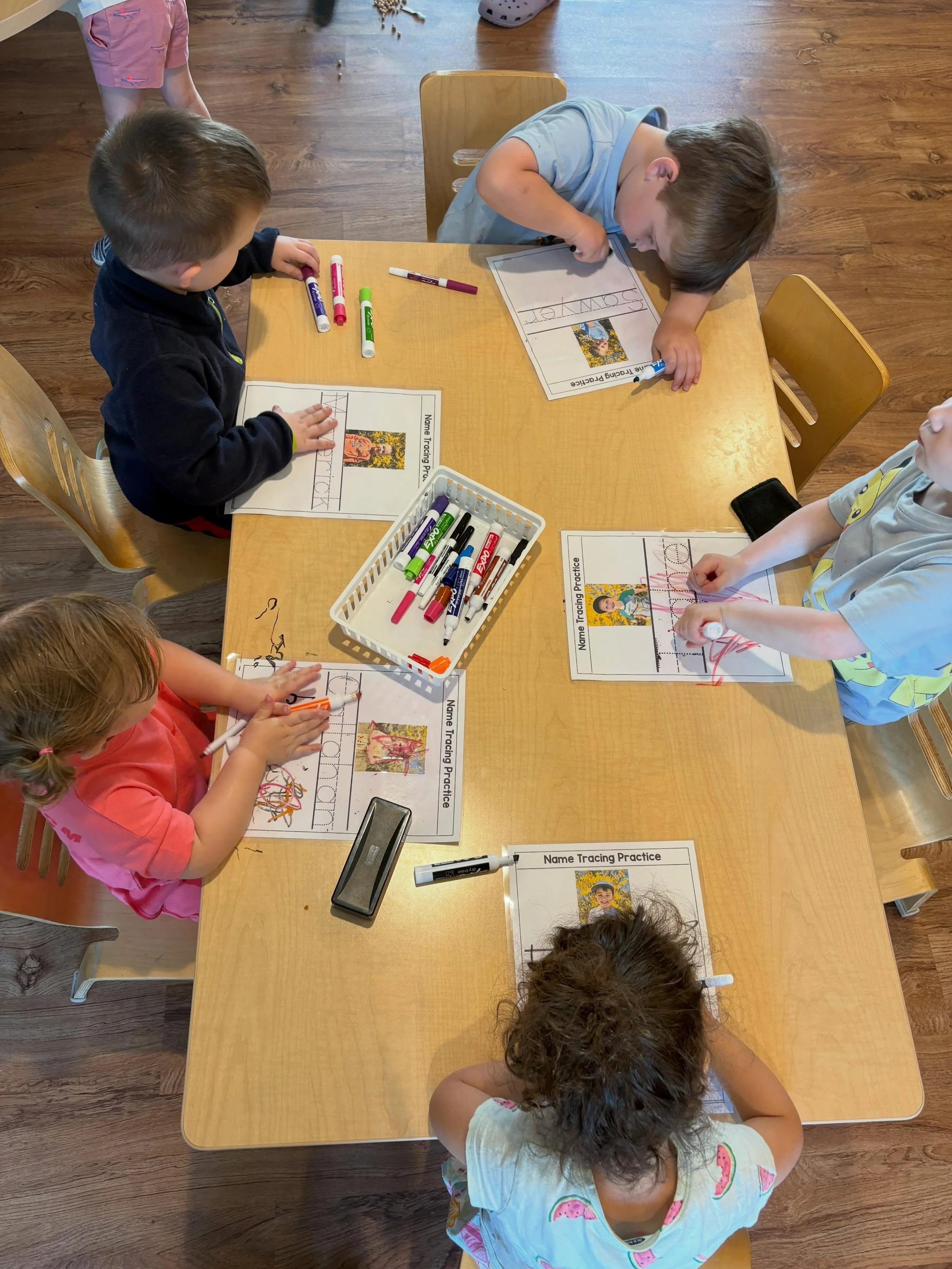 The toddler classroom has been feeling ready to look at their names and notice the different letters alongside their familiar faces! 👋

Name tracing and recognition are foundational early literacy skills that build fine motor control and letter fami