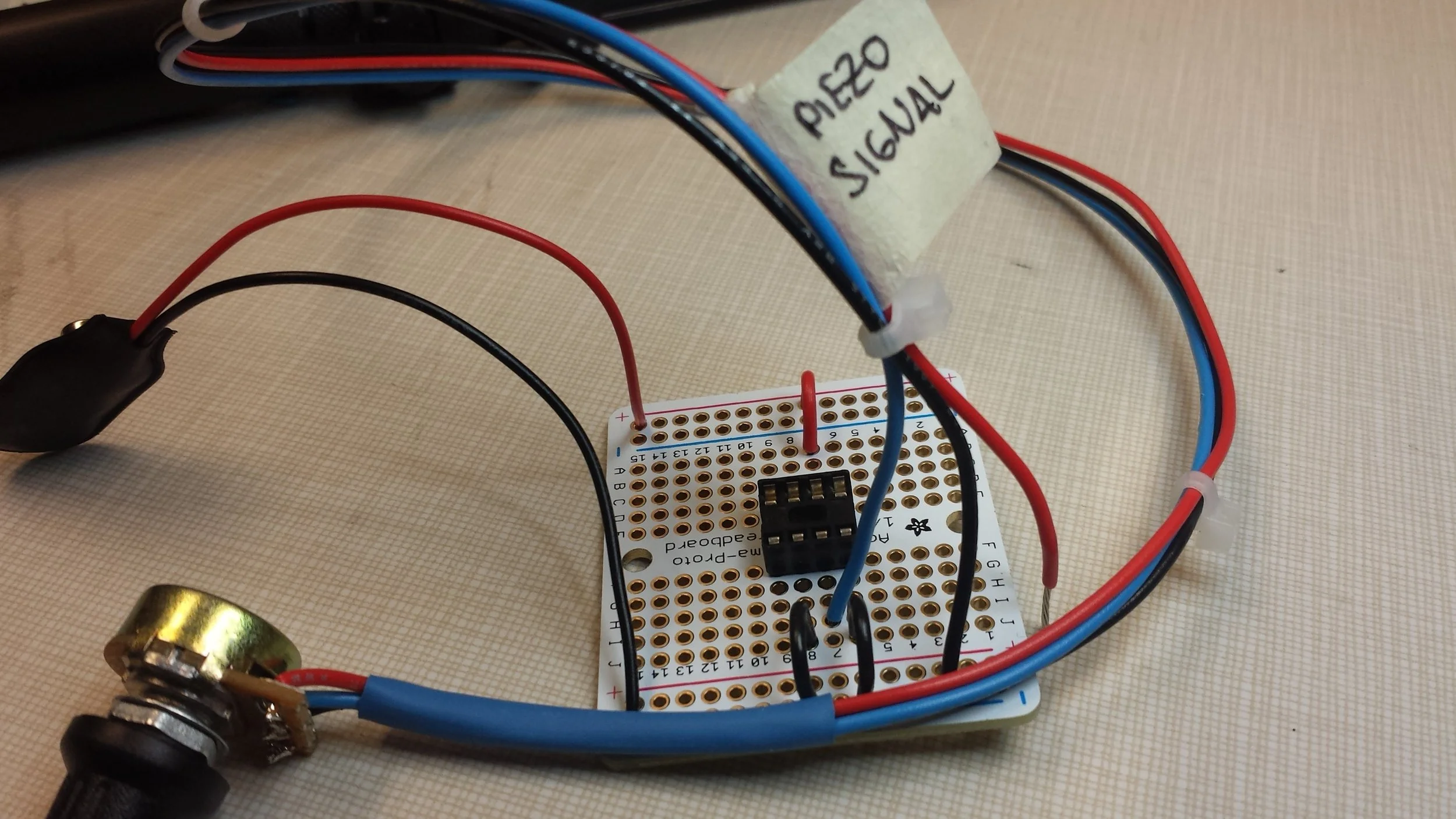 I decided to add heat shrink tubing on the wires coming out of the potentiometer for extra security and snugness. To control the flow of wire, I added zip ties and attached it to the board shortly after.
