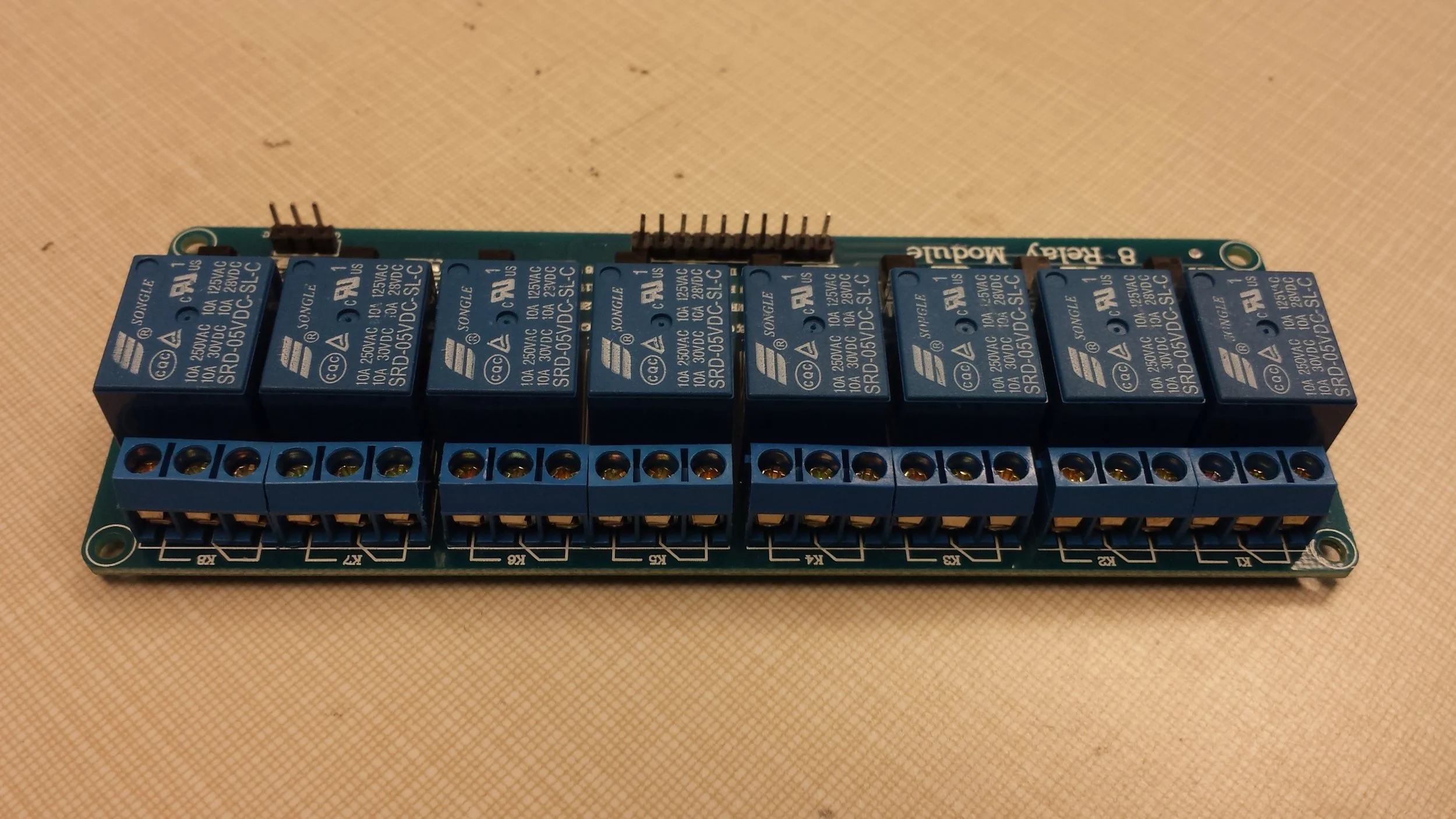 I went online and bought myself an 8-channel relay from Adafruit