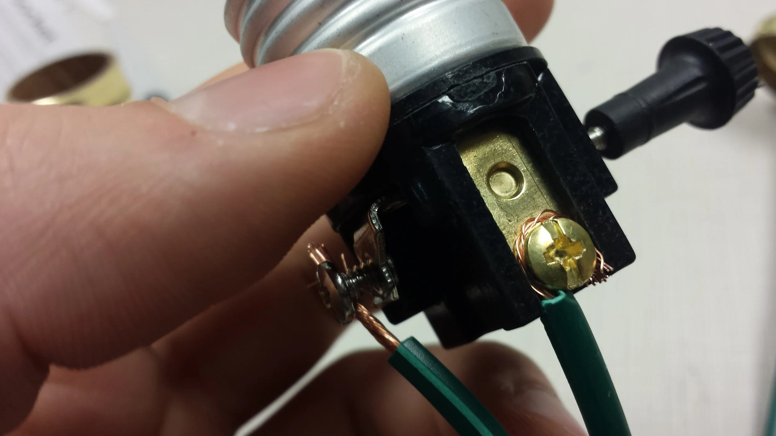 In the picture above, note how the cord on the right corresponds to the hot connection and the one on the left corresponds with the neutral.
