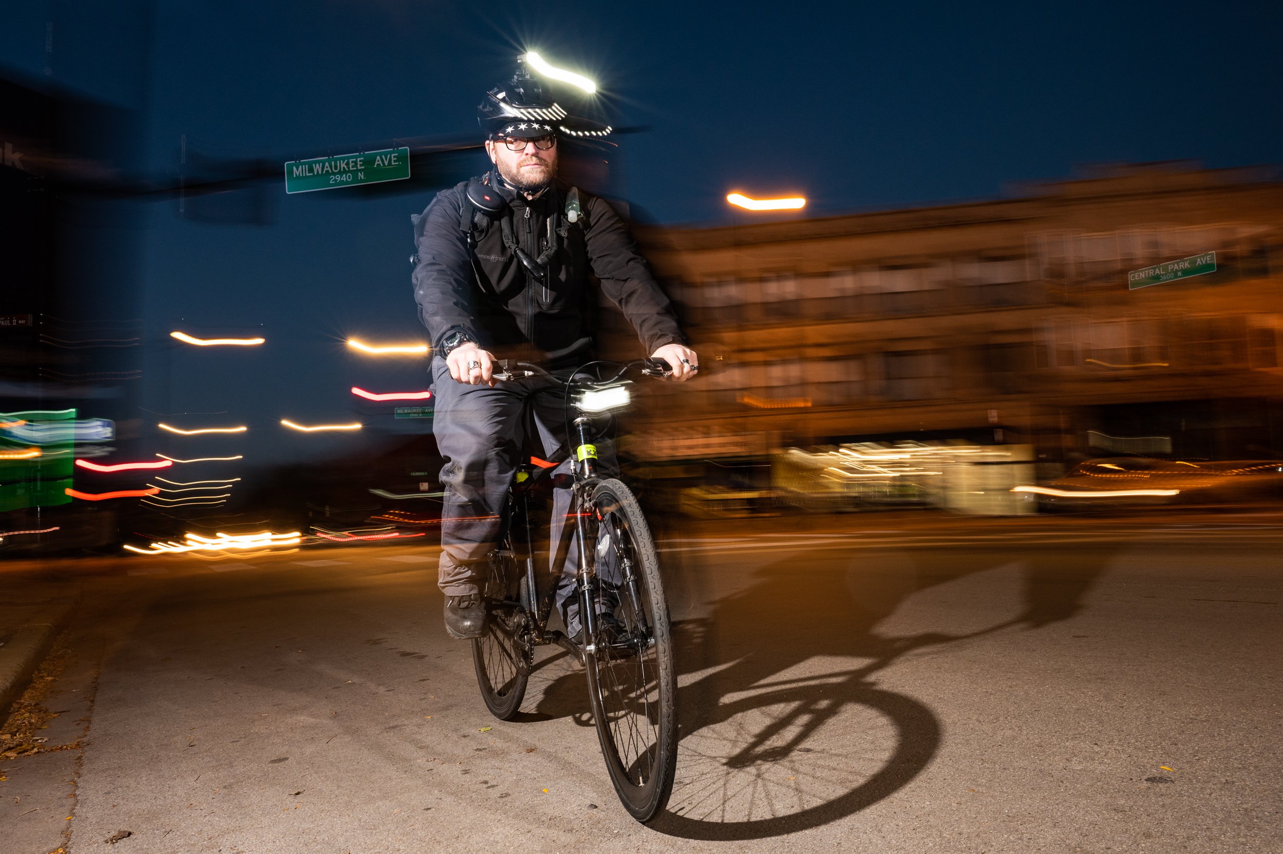  Bike courier Angel Avado poses for a photo at the intersection of Milwaukee and Central Park avenues on Oct. 26, 2022, near where he was doored by a driver. | Colin Boyle/Block Club Chicago 