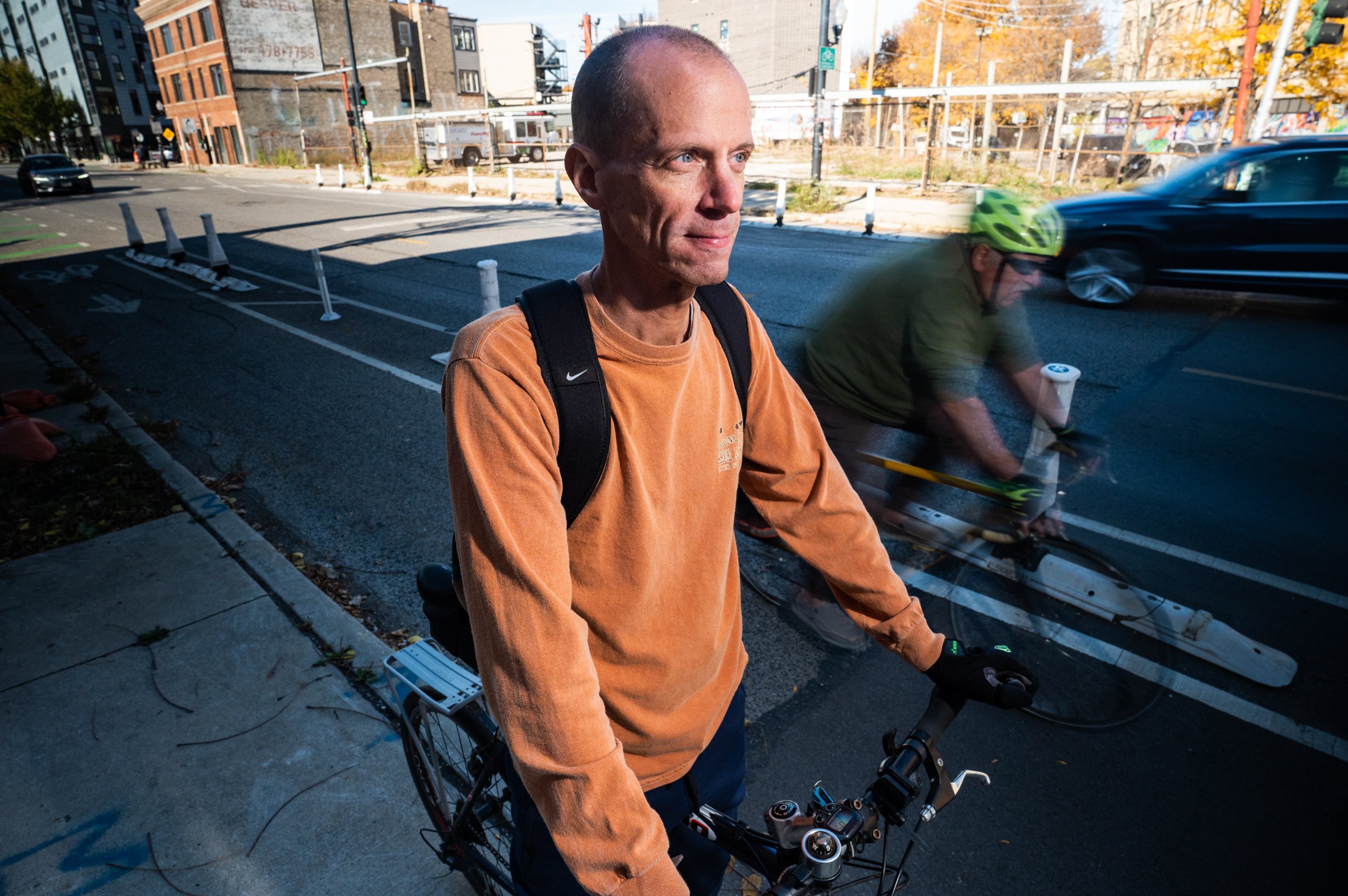  Cyclist Mark Langenderfer poses on his bicycle on Oct. 28, 2022 at the intersection of Milwaukee Avenue and Francis Place, where he was hit by a turning car. 