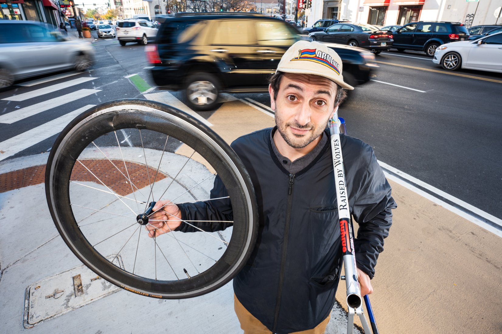  Cyclist Gevork Chubaryan poses with his damaged bike frame and front wheel on Oct. 28, 2022 at the intersection of Milwaukee Avenue and Division Street, where he was hit by a turning car. 