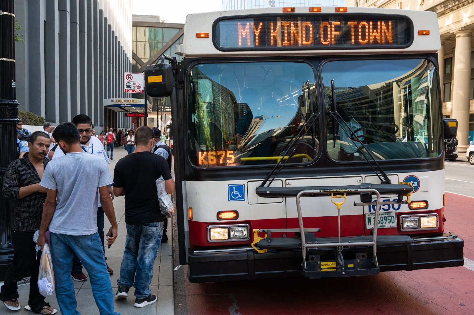  A CTA bus shuttle reads “My Kind of Town Chicago Is” as migrants disembark a bus at Union Station after a 25-hour-long ride from Texas on Sept. 9, 2022. | Colin Boyle/Block Club Chicago 