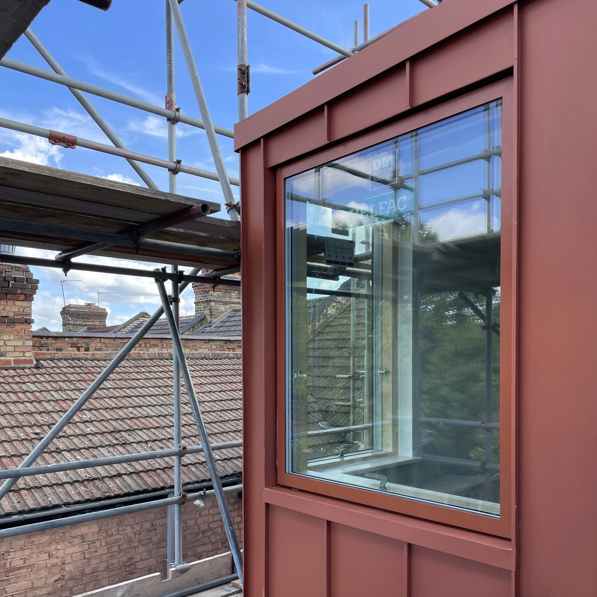 Standing seam red cladding loft extension