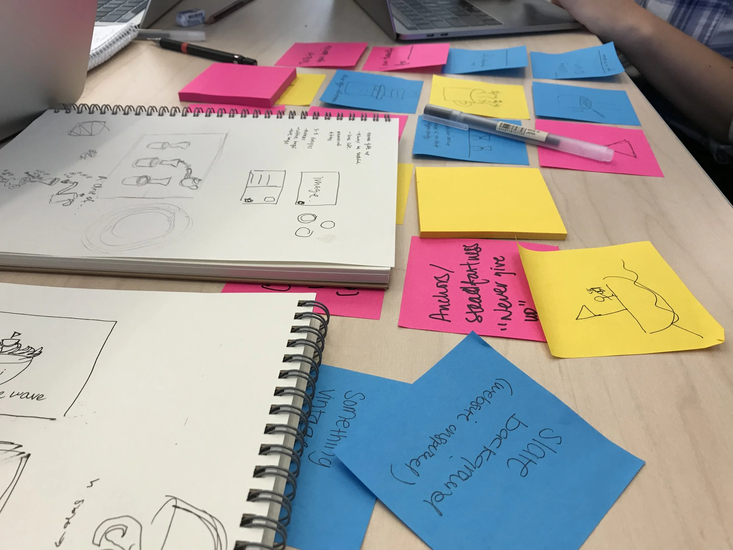 Hard at work merging our ideas and sketches into final designs.