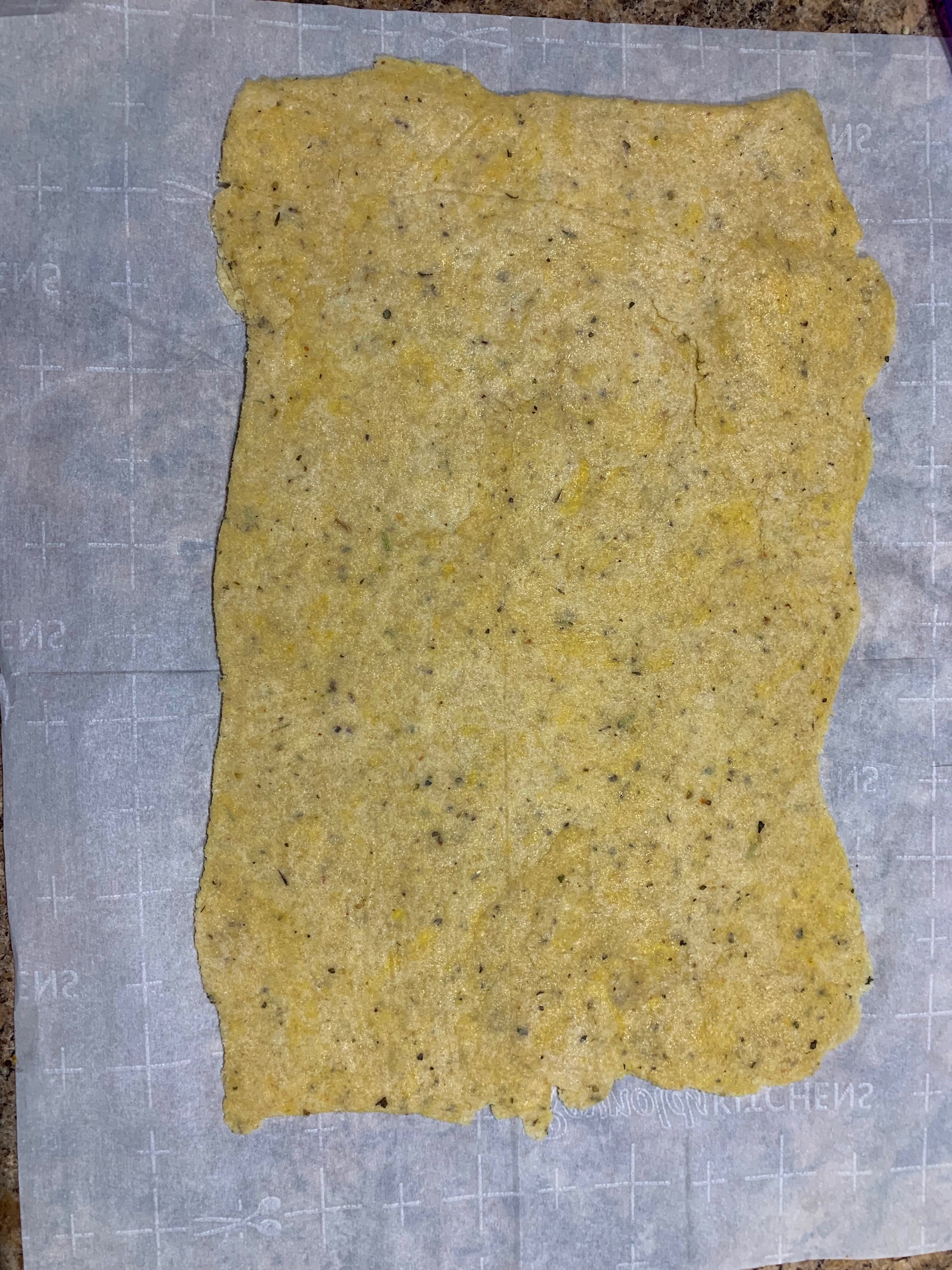 The dough rolled out into a rectangle