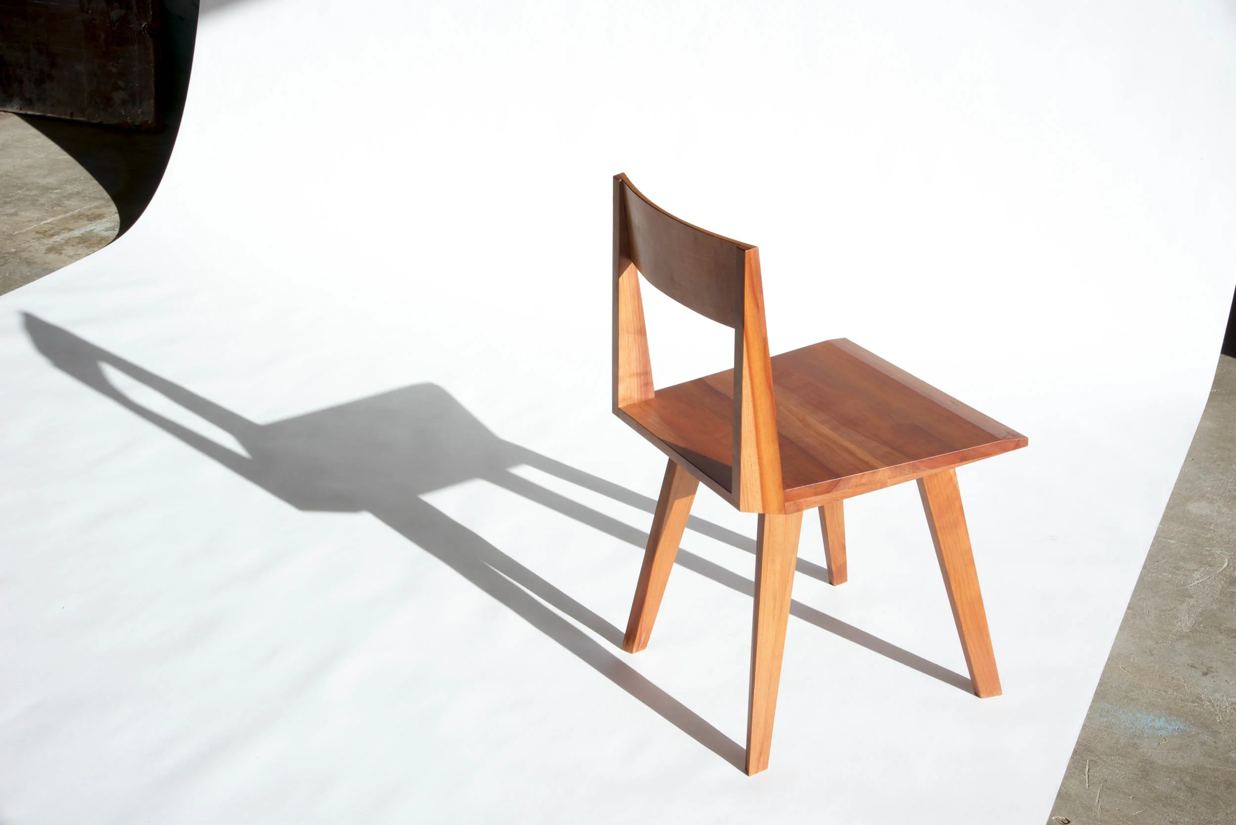 This chair is made with madrone. Its also available in walnut.