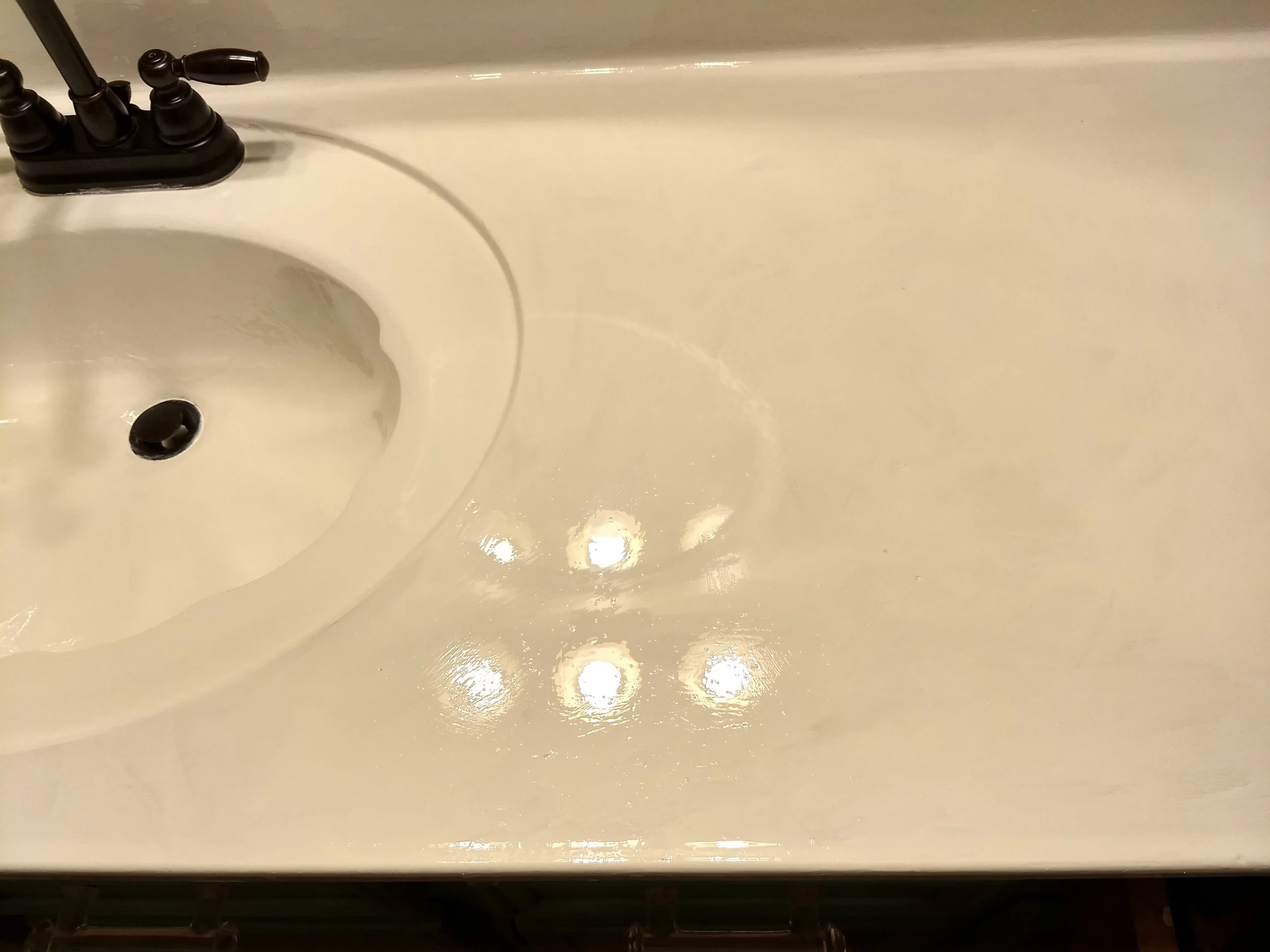 Two coats on the sink, one on the countertop. One more coat to go on the counter and I’ll be done!