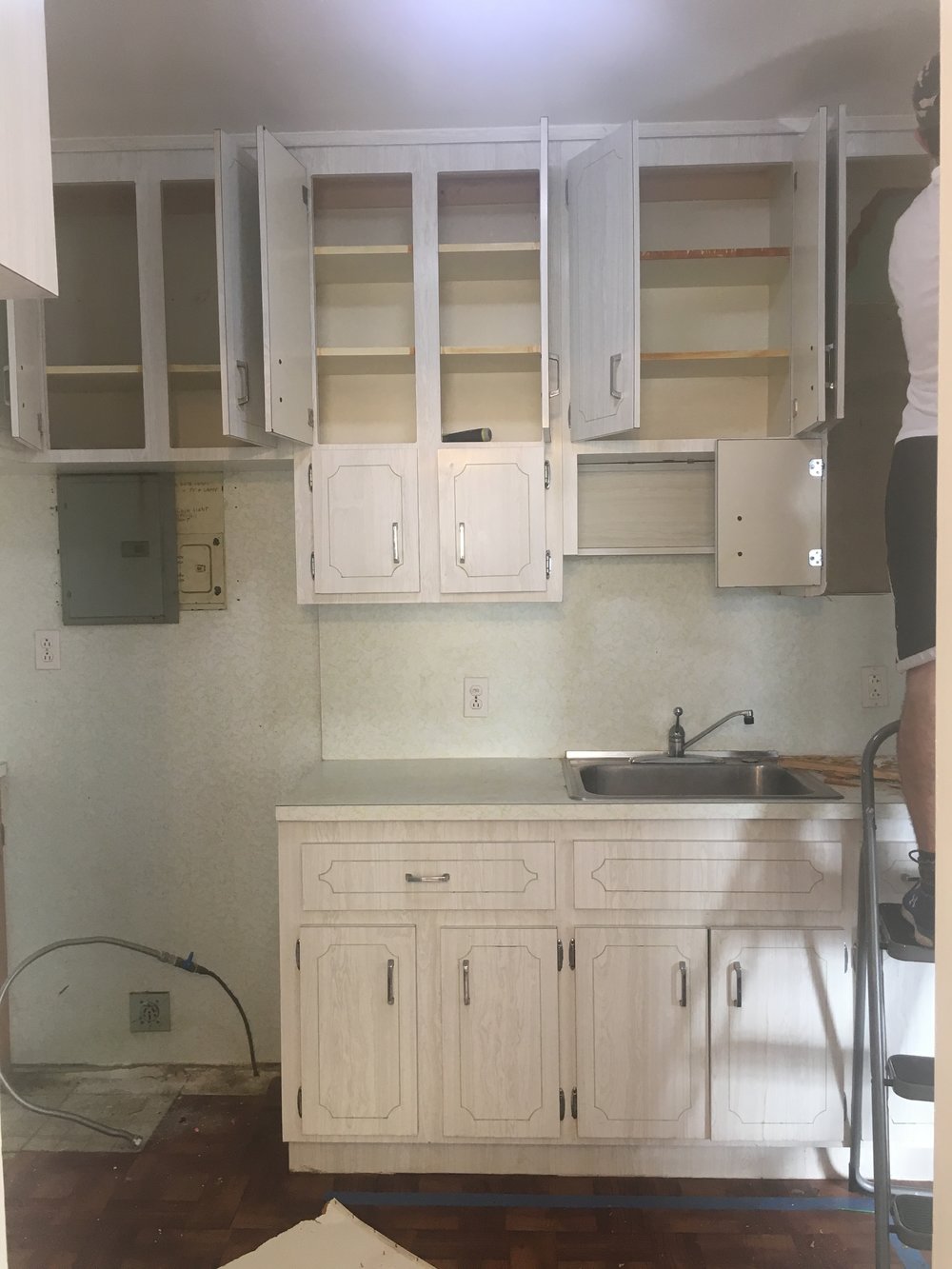  We moved the refrigerator and range to another room in the house to re-use them in the new kitchen 