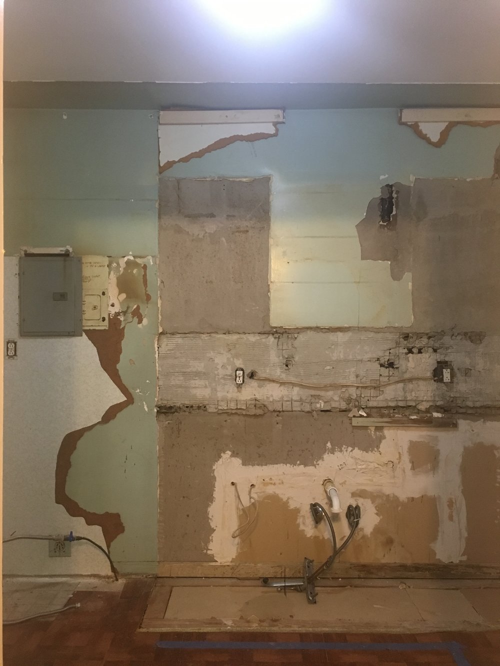  Behind all the cabinets were the remnants of the previous kitchen paint color…green was all the rage in Miami in the 1950’s. We’re glad to see it go! 
