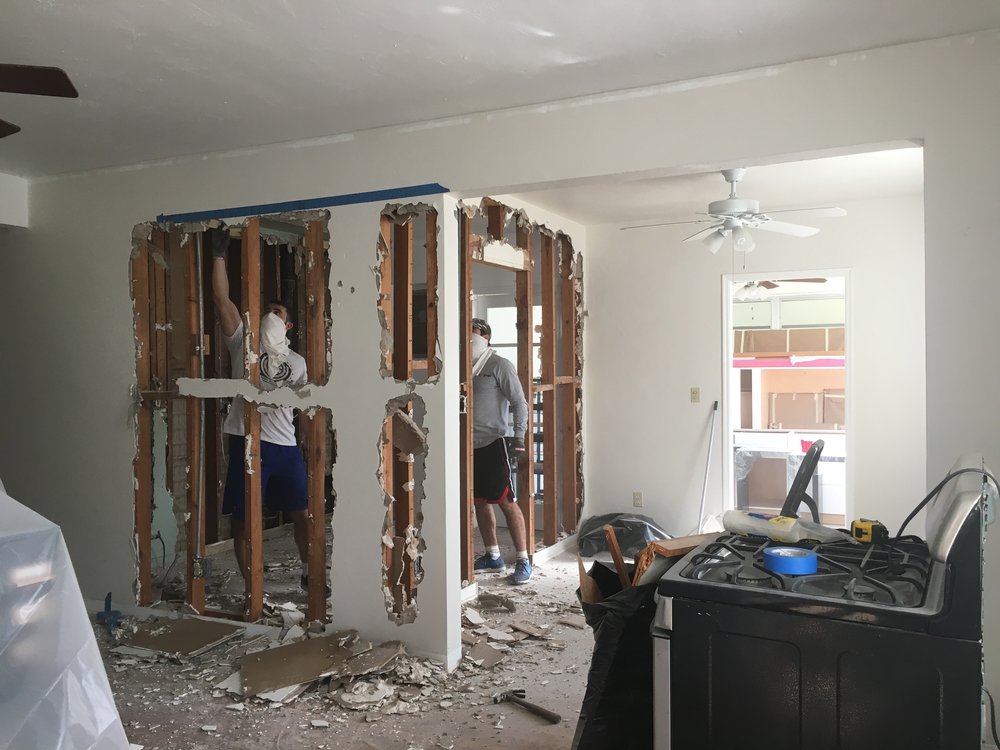  My brother and husband did 99% of the demolition  (they were incredible and can’t thank them enough!) , while I picked up the debris. We knocked down the wall dividing the kitchen from the dining room as well as part of the wall dividing the kitchen