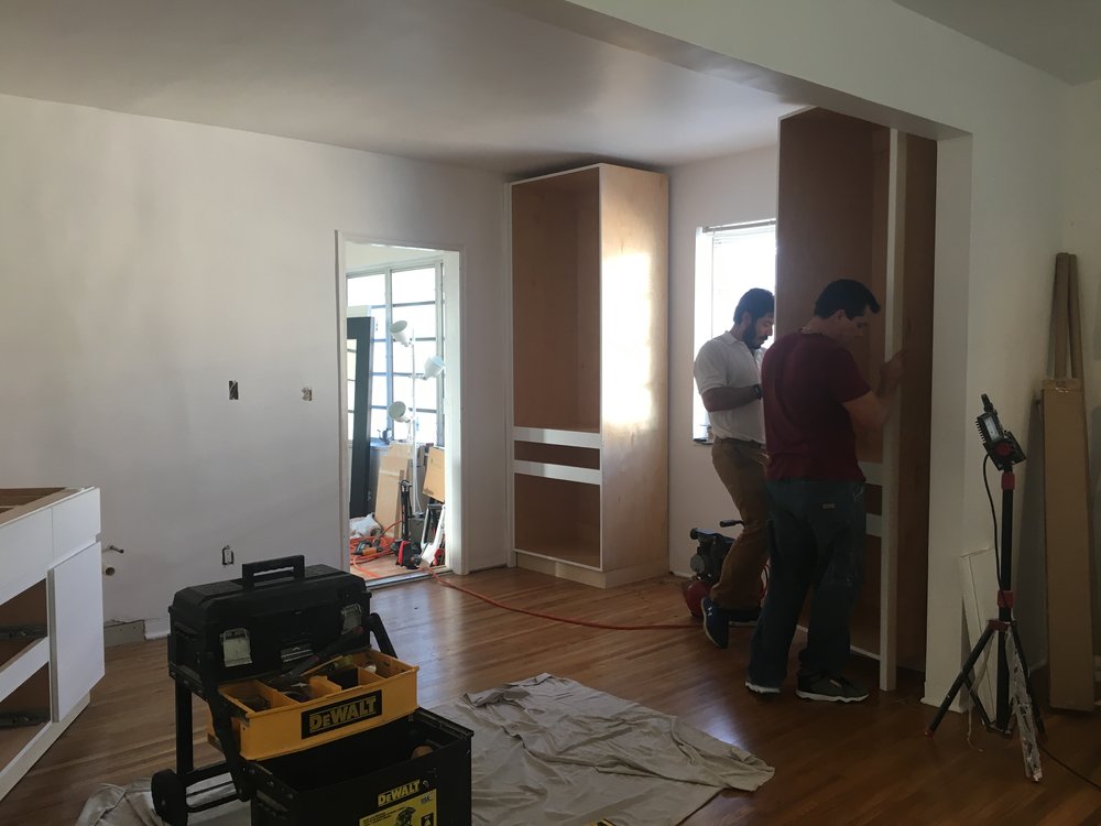  Once the walls were patched, smoothed and painted, we were ready to install the cabinets!  