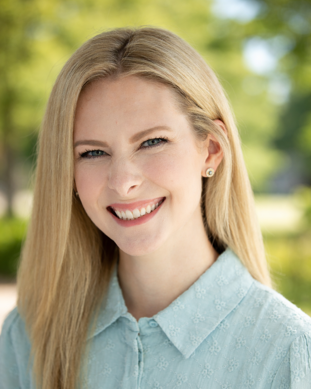 Close-up of delicate grass stems and seed heads against a soft, blurry background.