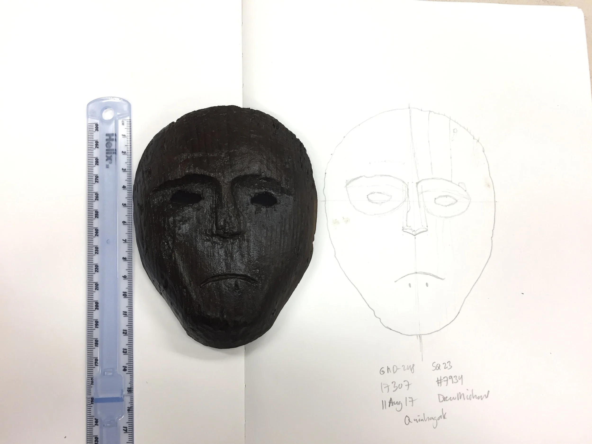 Drawing the mask found in situ after it has been cleaned and now documented. 