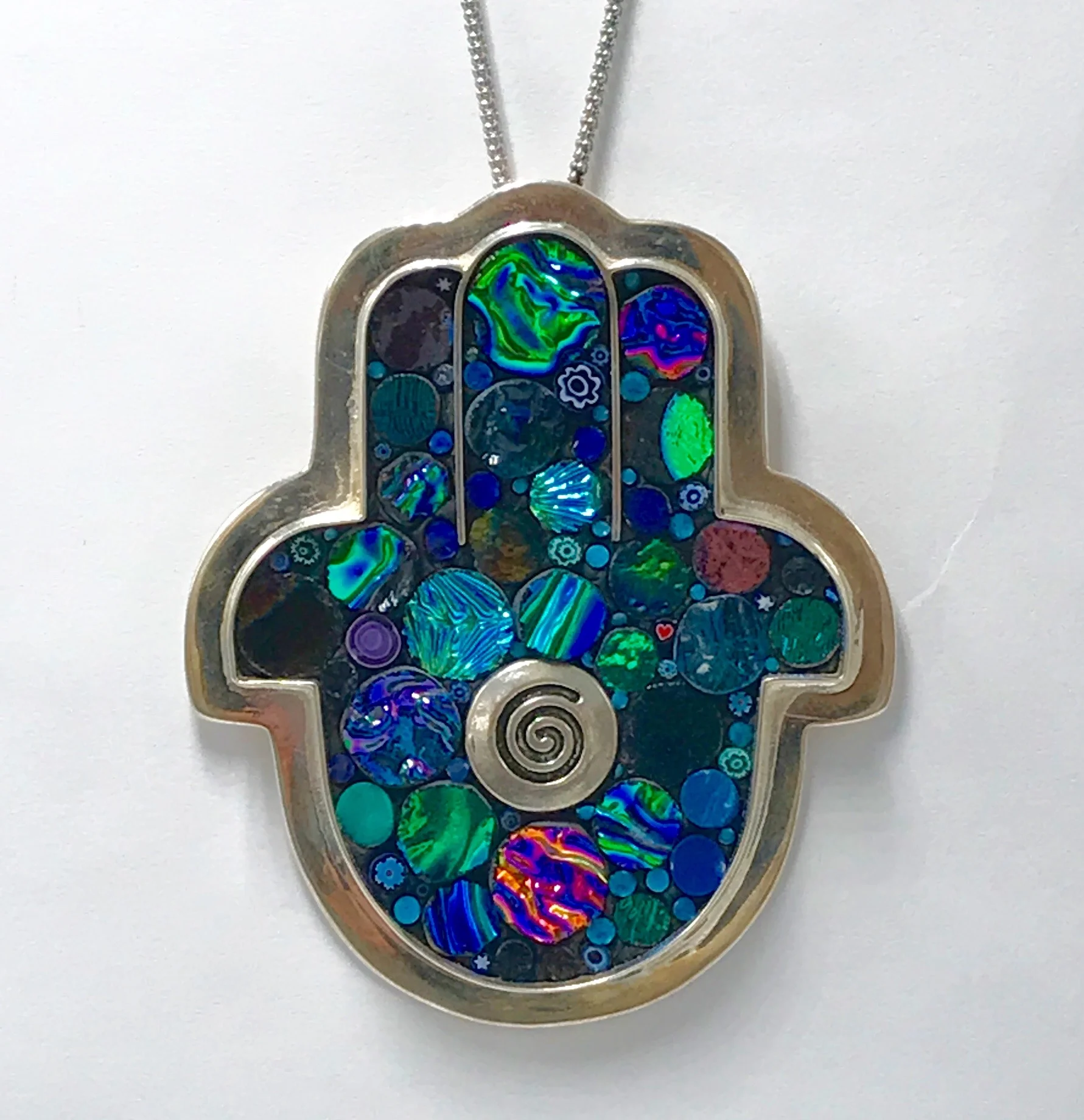 DichroBlueSpiralHamsaNecklace.jpg