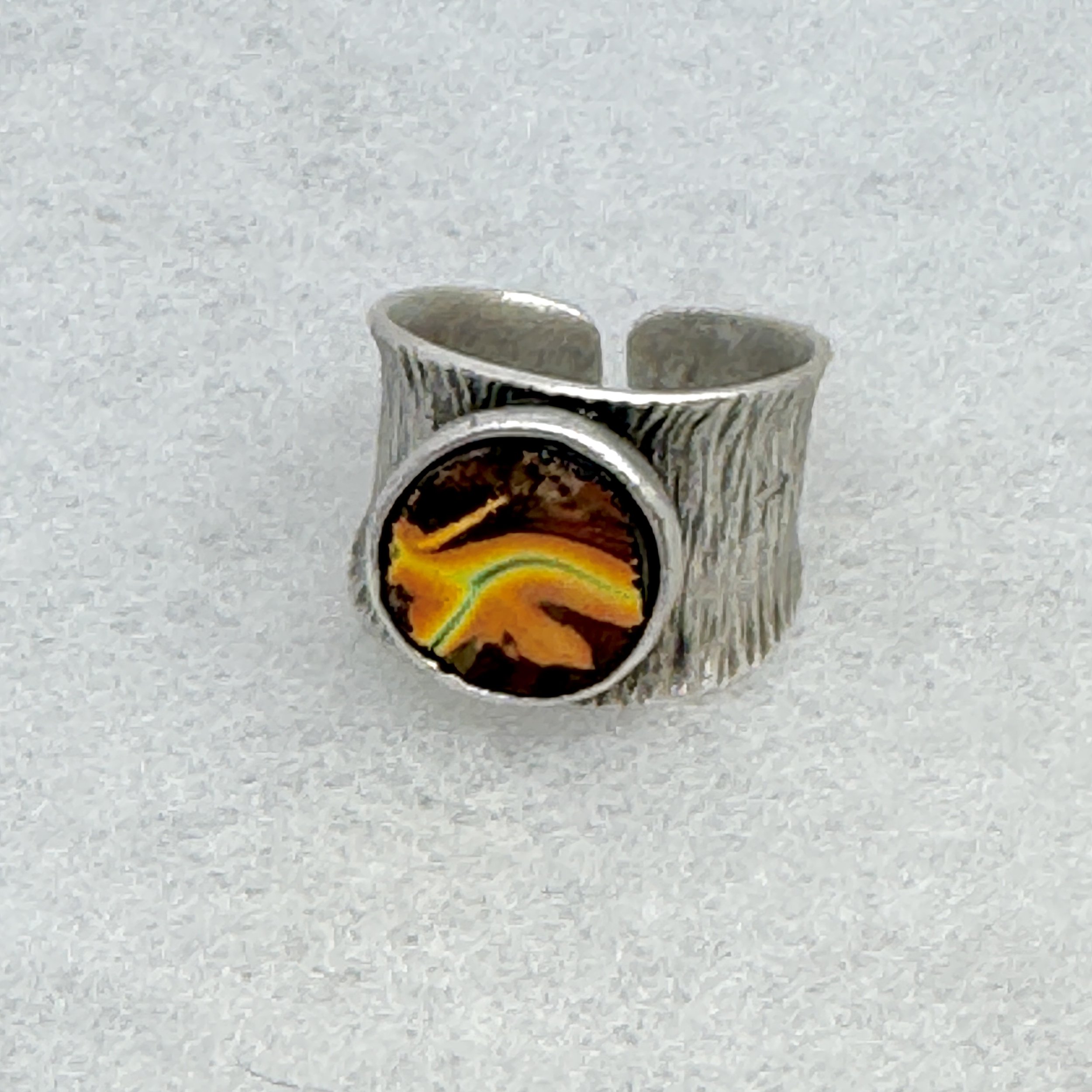 WIde curved Orange dichro ring.jpeg