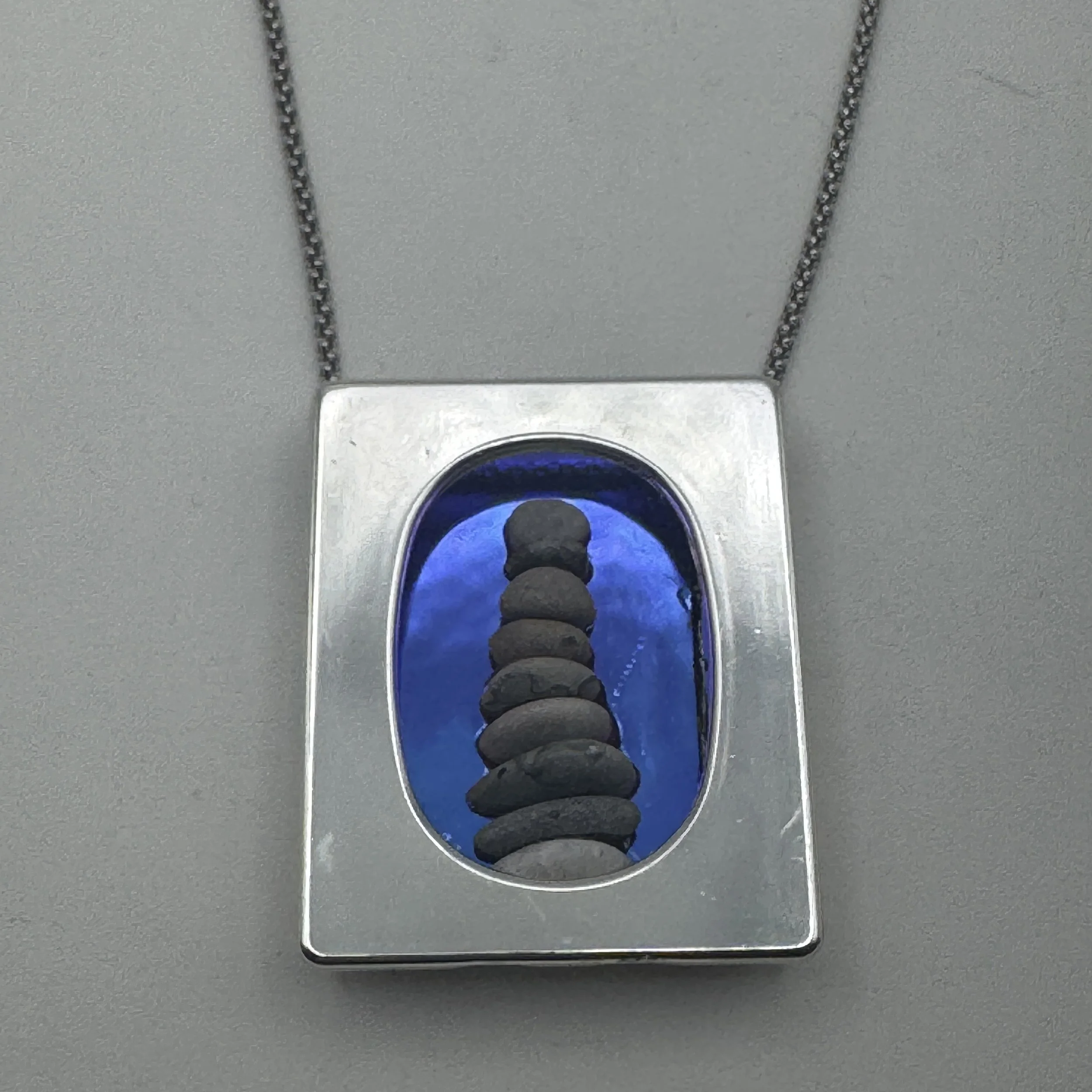 Framed Pebble Cairn Necklace.jpeg