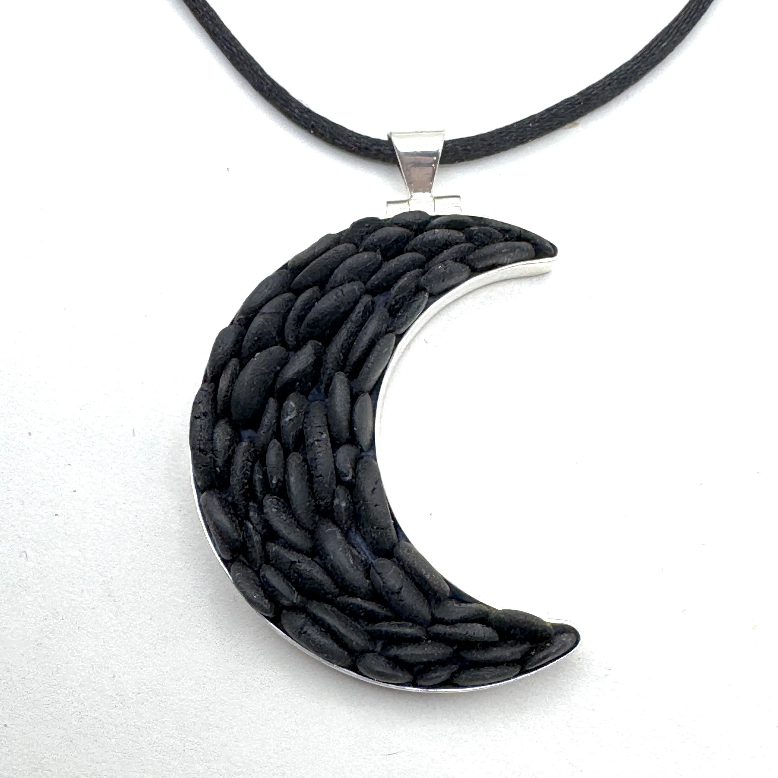 Black Pebble Crescent Moon Necklace.jpeg