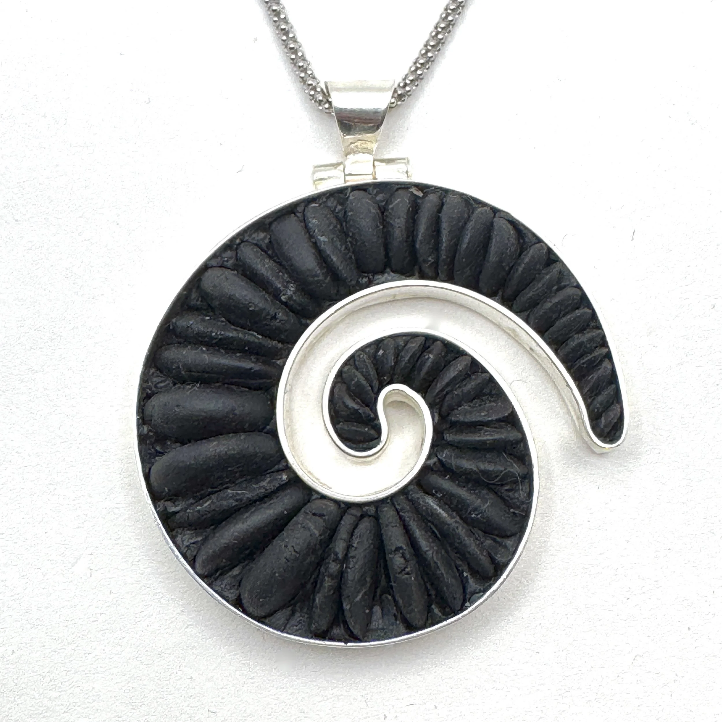 Black Pebble Small Koru.jpeg