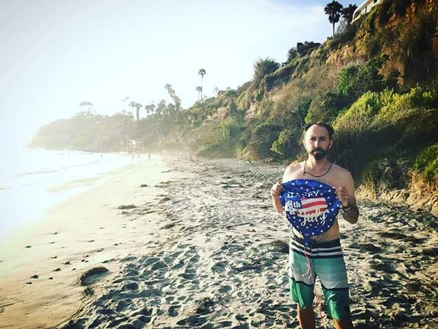 THE DAY: It was a few days after July 4th and I was enjoying a sun-shiny day at the beach with some pals of mine, tossing the frisbee and enjoying the warmer water.  Scanning the horizon I noticed something sizable bobbing past the break on the water