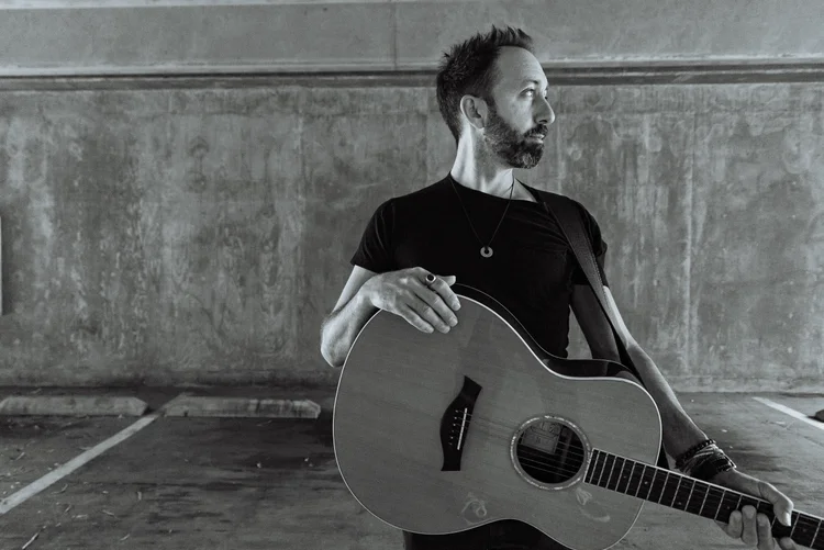 Justin Froese with acoustic guitar