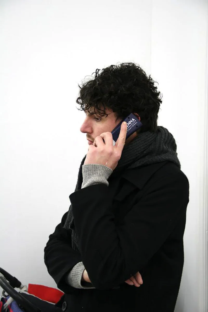 Visitor listening to the audiotour