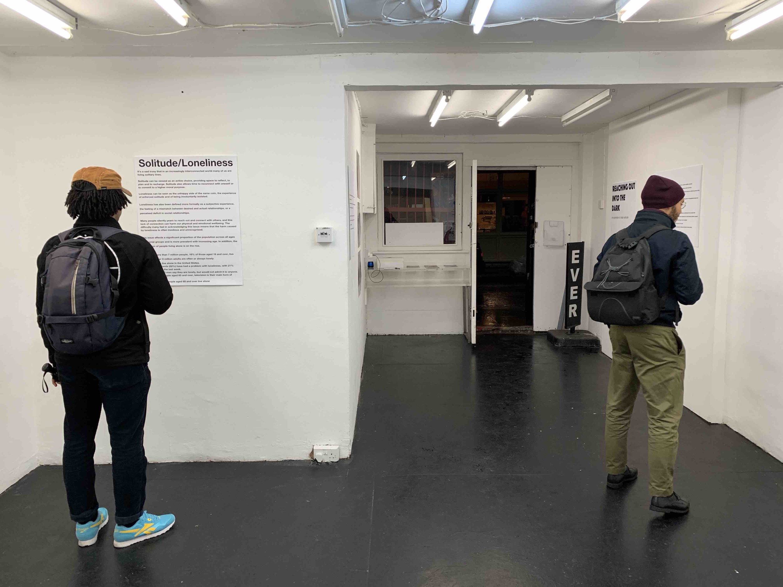 Exhibition visitor reading text