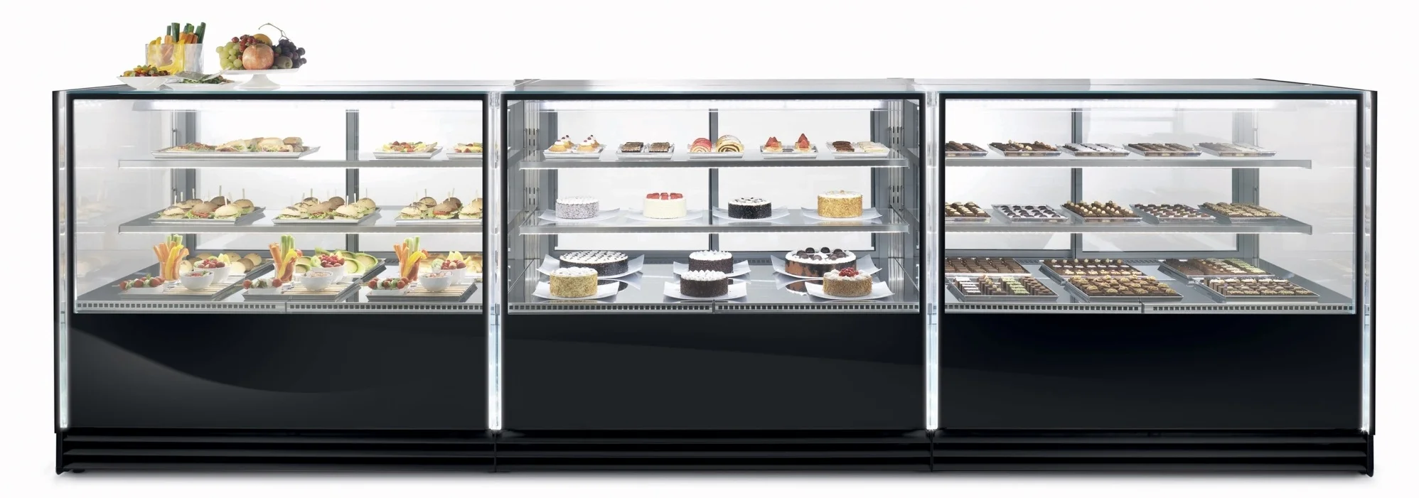 VIK All new complete and versatile line of refrigerated showcases properly studied for pastry, confectionery and gastronomy available in different heights. Hygienic, energy-saving double-glazed sliding doors.