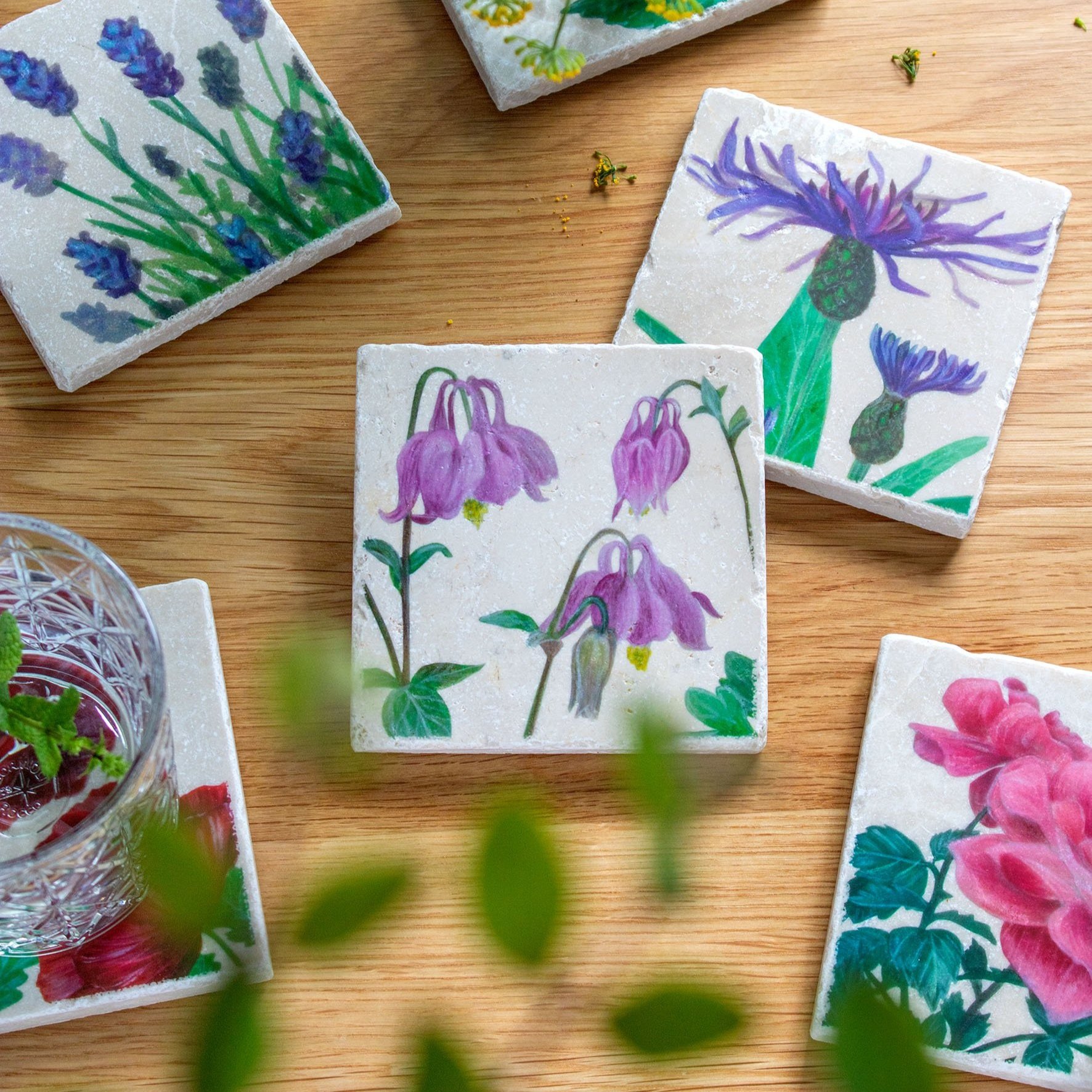 Garden+Coasters-on+wooden+table-columbine+focus.jpg