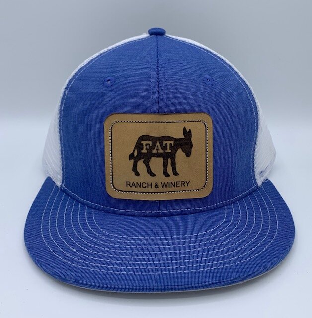 https://images.squarespace-cdn.com/content/v1/59de2d7d3e00be15fdb901ef/1633975962119-U9IGO65FRJOG04WXV4VL/Blue+Trucker+Cap+with+Leather+Patch.jpg?format=1000w