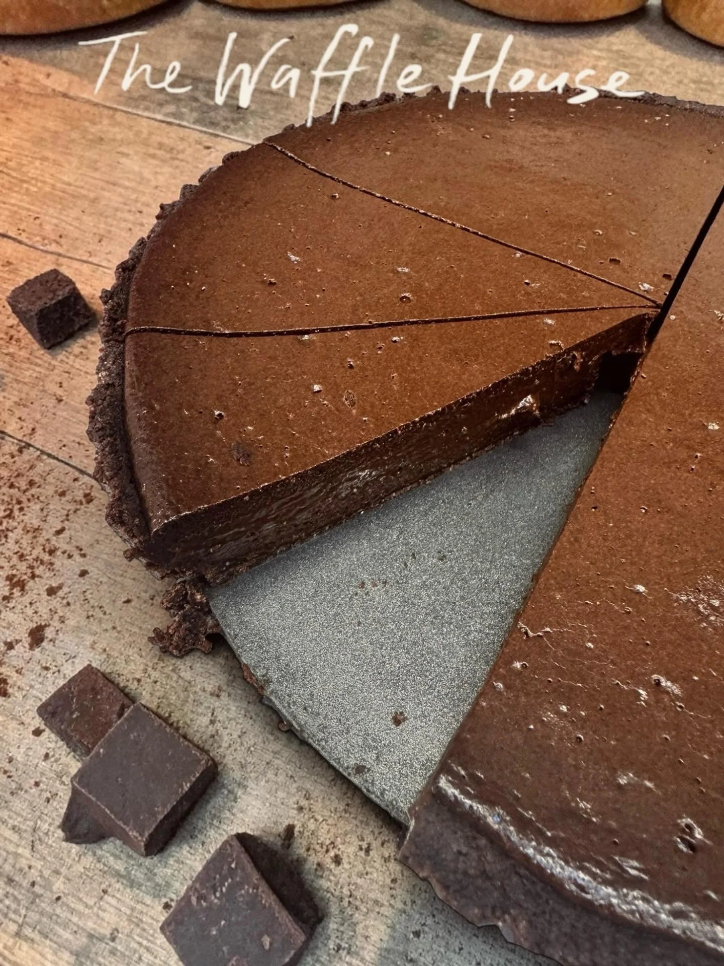 Homemade chocolate torte - Lightly whipped Belgian chocolate ganache on a biscuit base, served with chocolate &amp; hazelnut sauce, vanilla ice-cream &amp; hazelnut praline @wafflehousenorwich