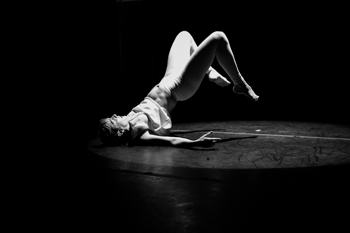 Karin Stevens at Velocity Dance Center performing (re)MOVE: Back Toward Again the (re)TURN Facing with live music by Wayne Horvitz in April 2016. Photography by Karen Mason Blair.