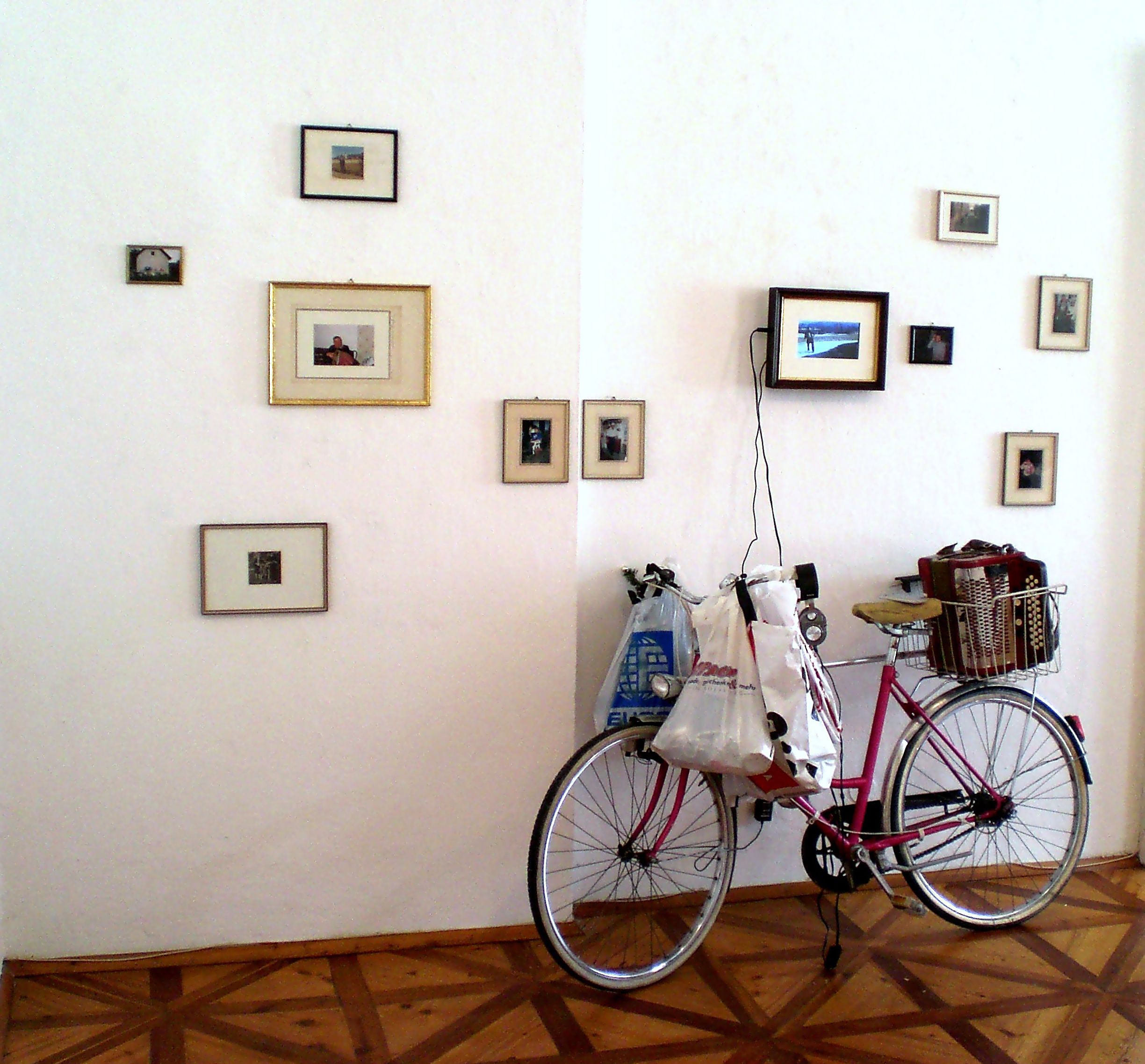 Familiensilber, Galerie3, photos of my grandaddy and his bicycle 100%, 8mm film, myself as grandaddy playing the quetschn, 2012 .jpg