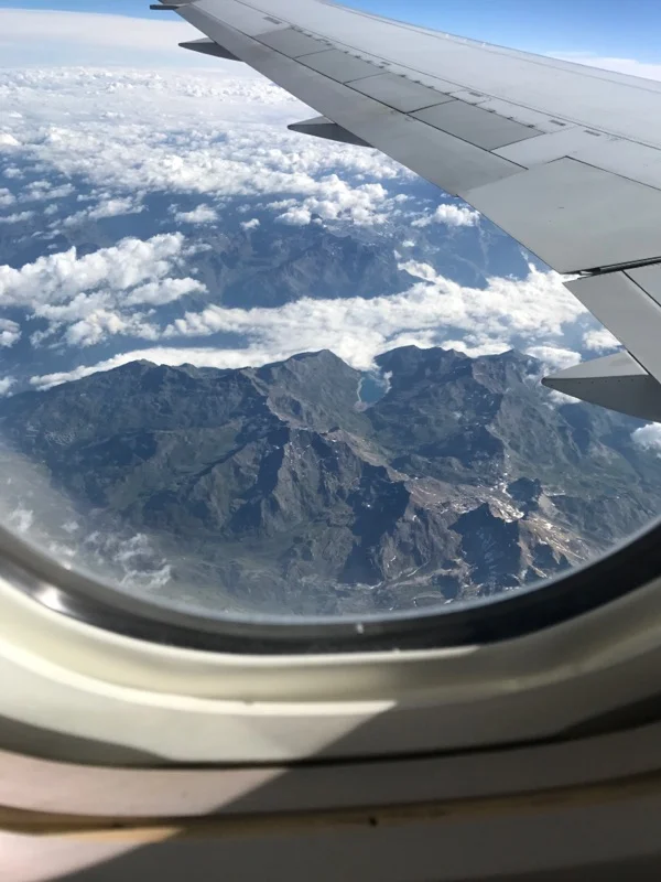 A view of the Alps, complete with picturesque valleys and lakes. 