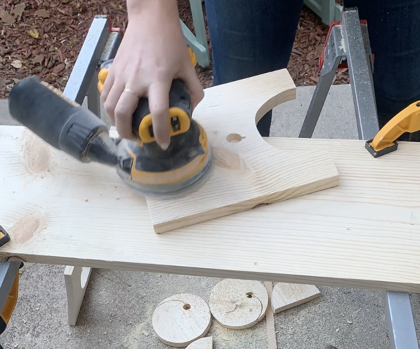 sanding wood board with orbital sander