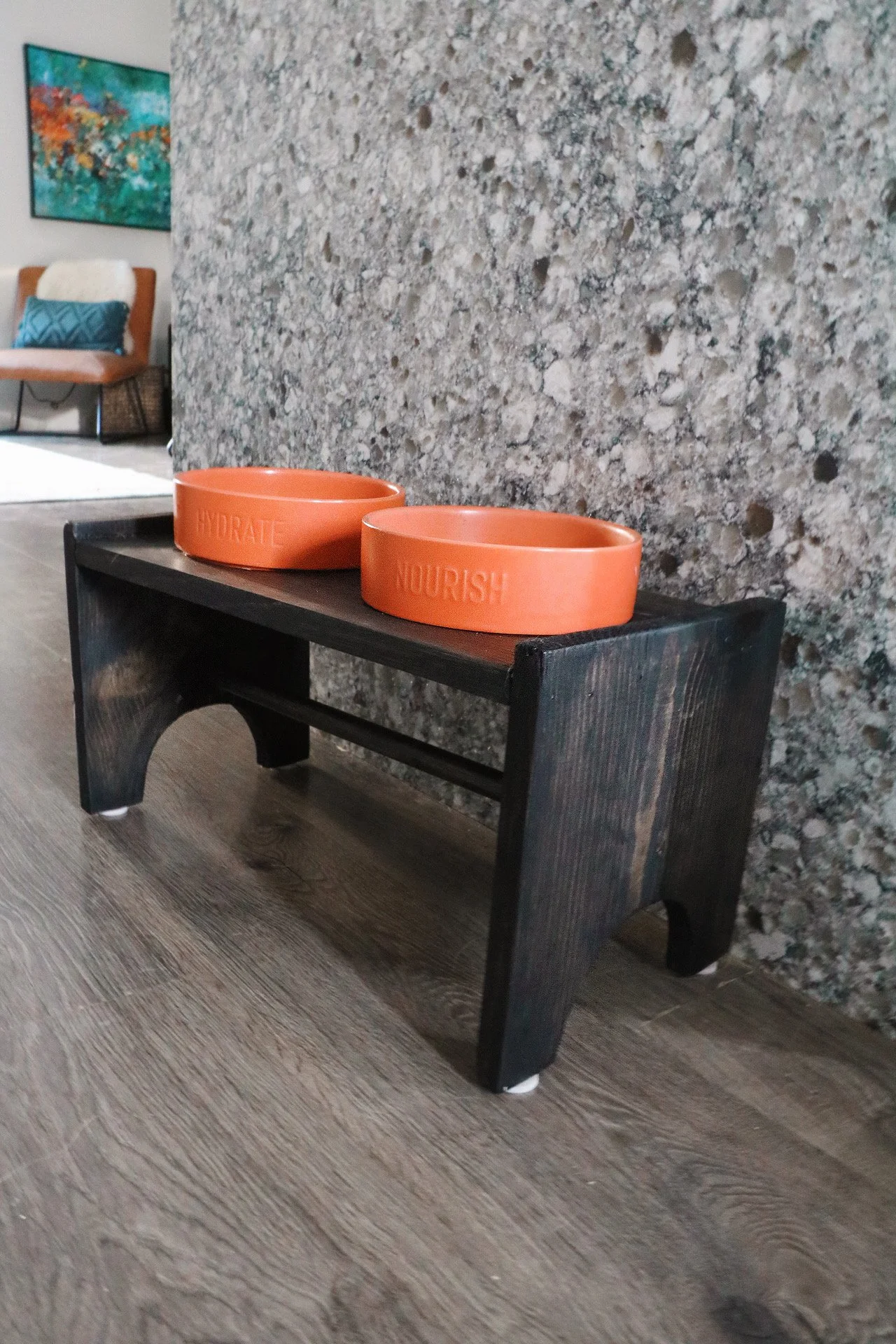 elevated dog bowl station next to waterfall edge granite countertop