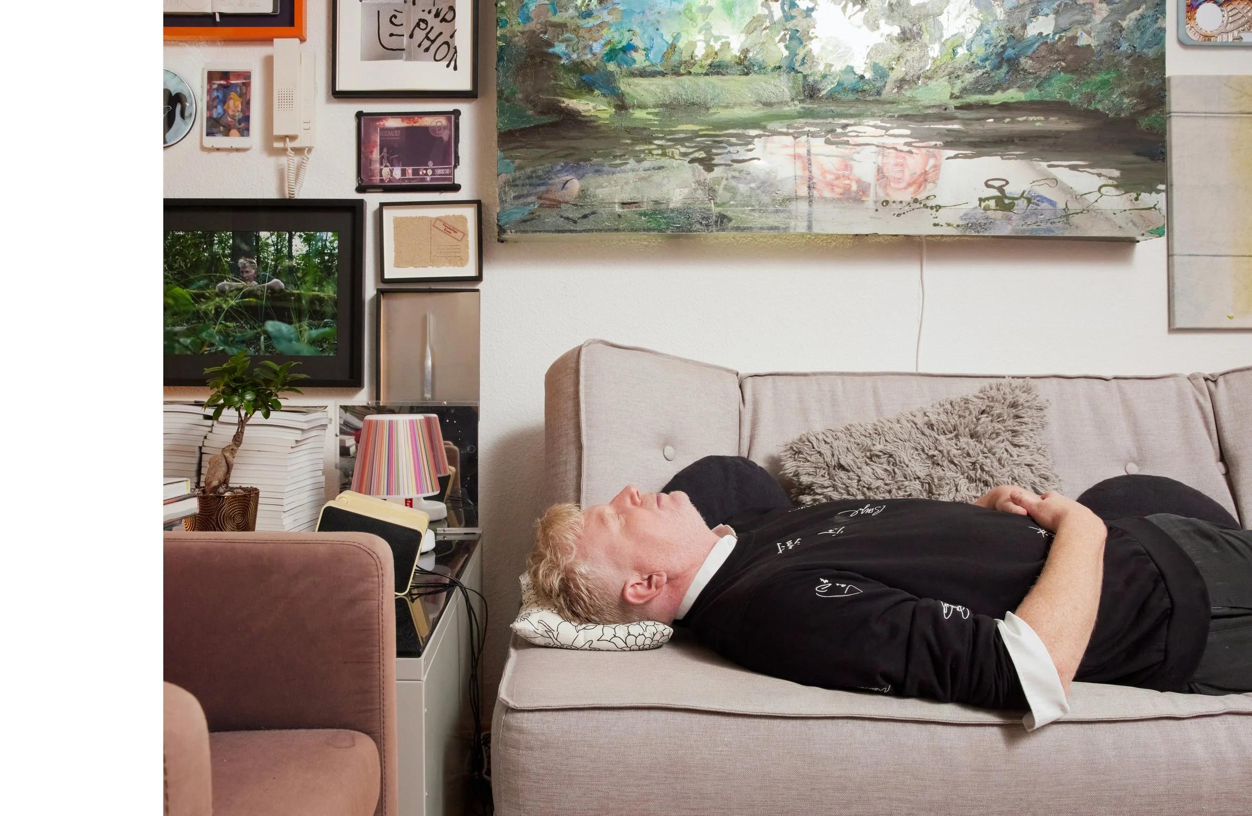 Gregor C. Blach in his Berlin apartment surrounded by works from the Spartakus Collection