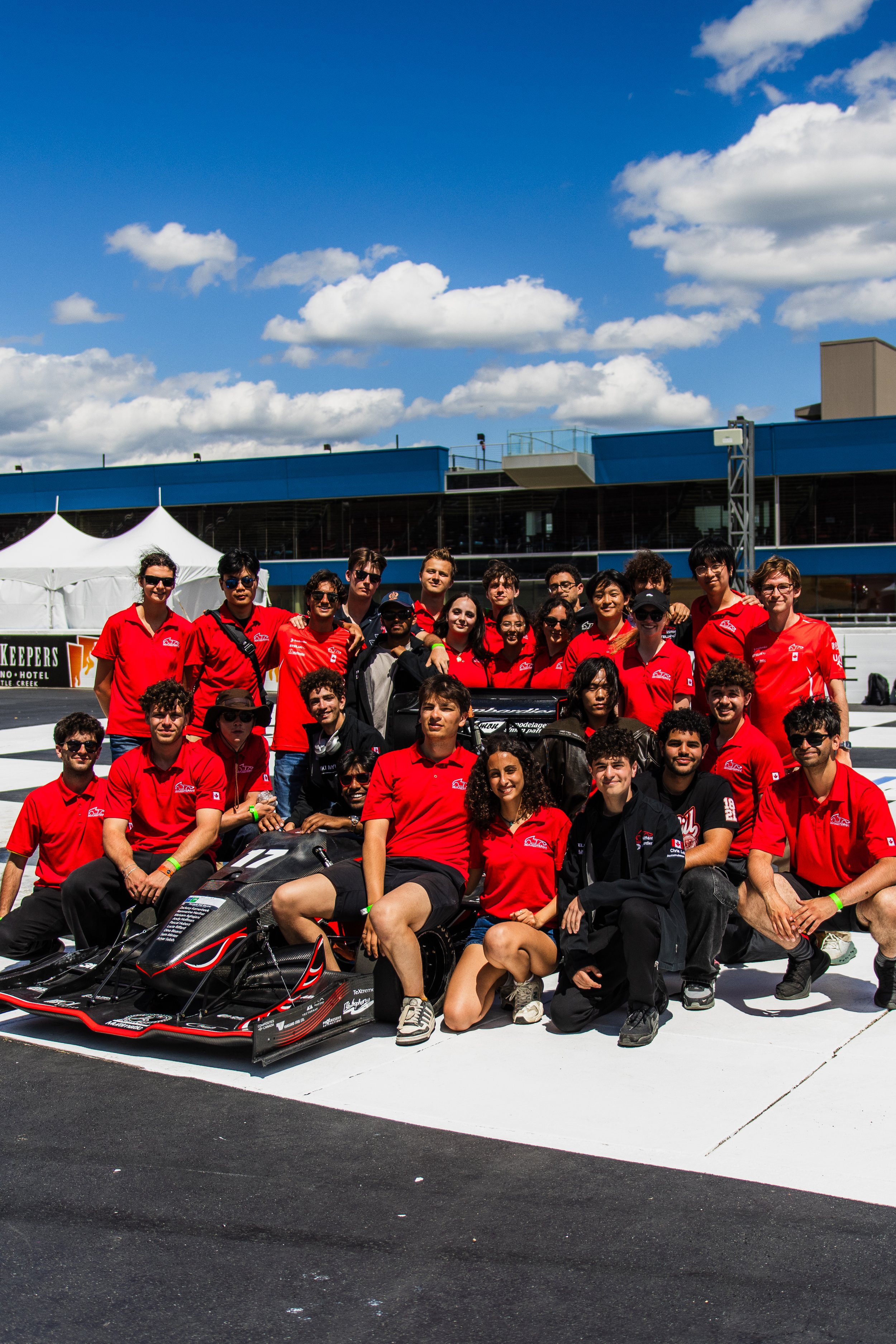 group pic around car.jpg