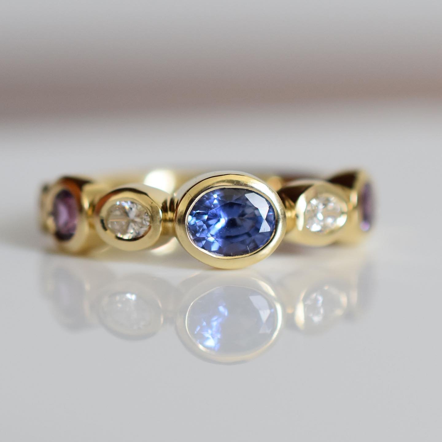 I have an amazing client that loves my bezel set jewellery and last summer we came up with this design together pushing blue sapphires around in a meeting. I loved her ring so much, I made a black and white diamond version I named Luna, and now most 
