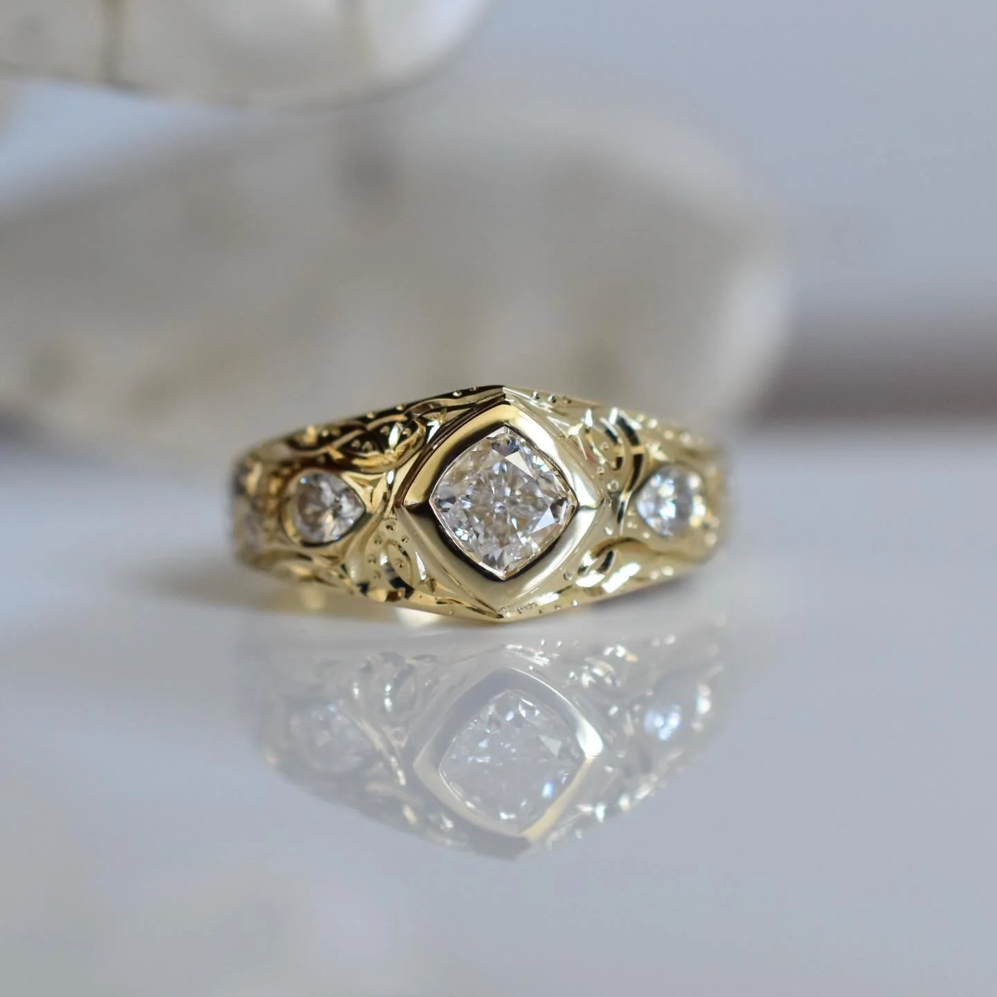 Engagement ring redo ✨

My clients wanted a change. I took their very traditional 3 stone plus small diamonds on the band engagement ring (white gold, claw set) apart and &ldquo;Erinified&rdquo; it. I carved up a new setting using her diamonds. I cas