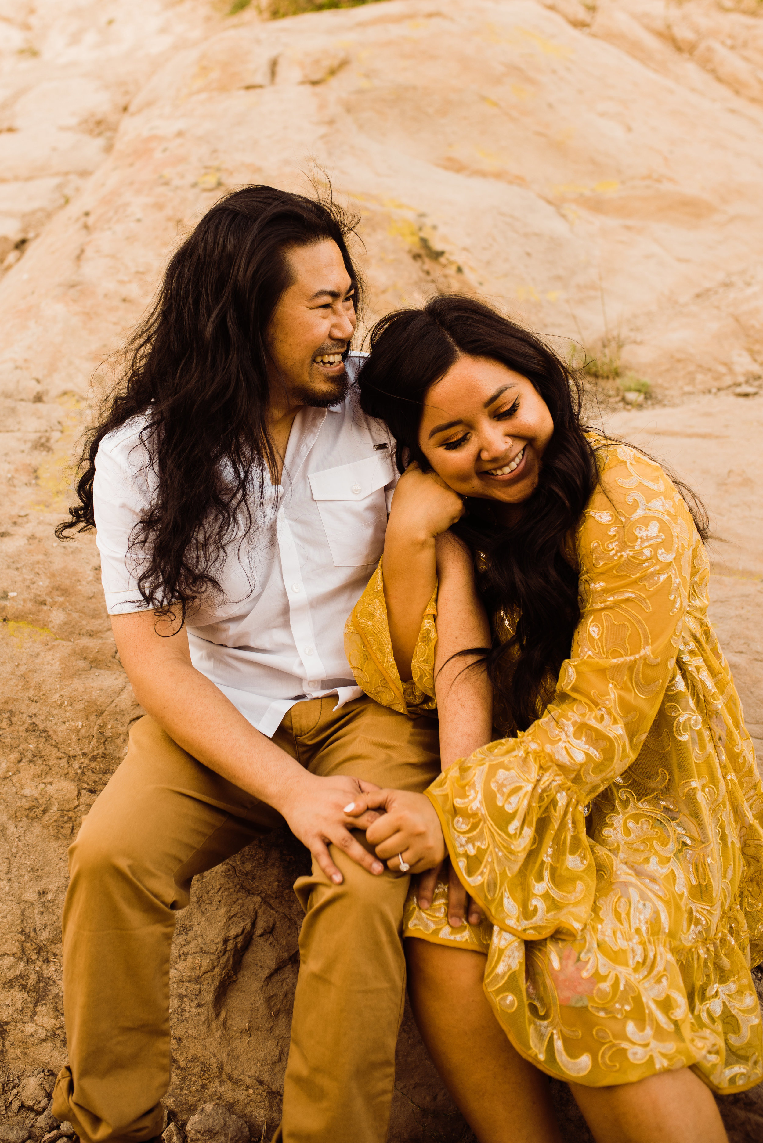 Engaged couple at Vasquez Rocks in Santa Clarita | Hawaiian-Phillipino couple with long dark hair wearing yellow outfits | Photos by adventurous elopement photographer Kept Record | www.keptrecord.com