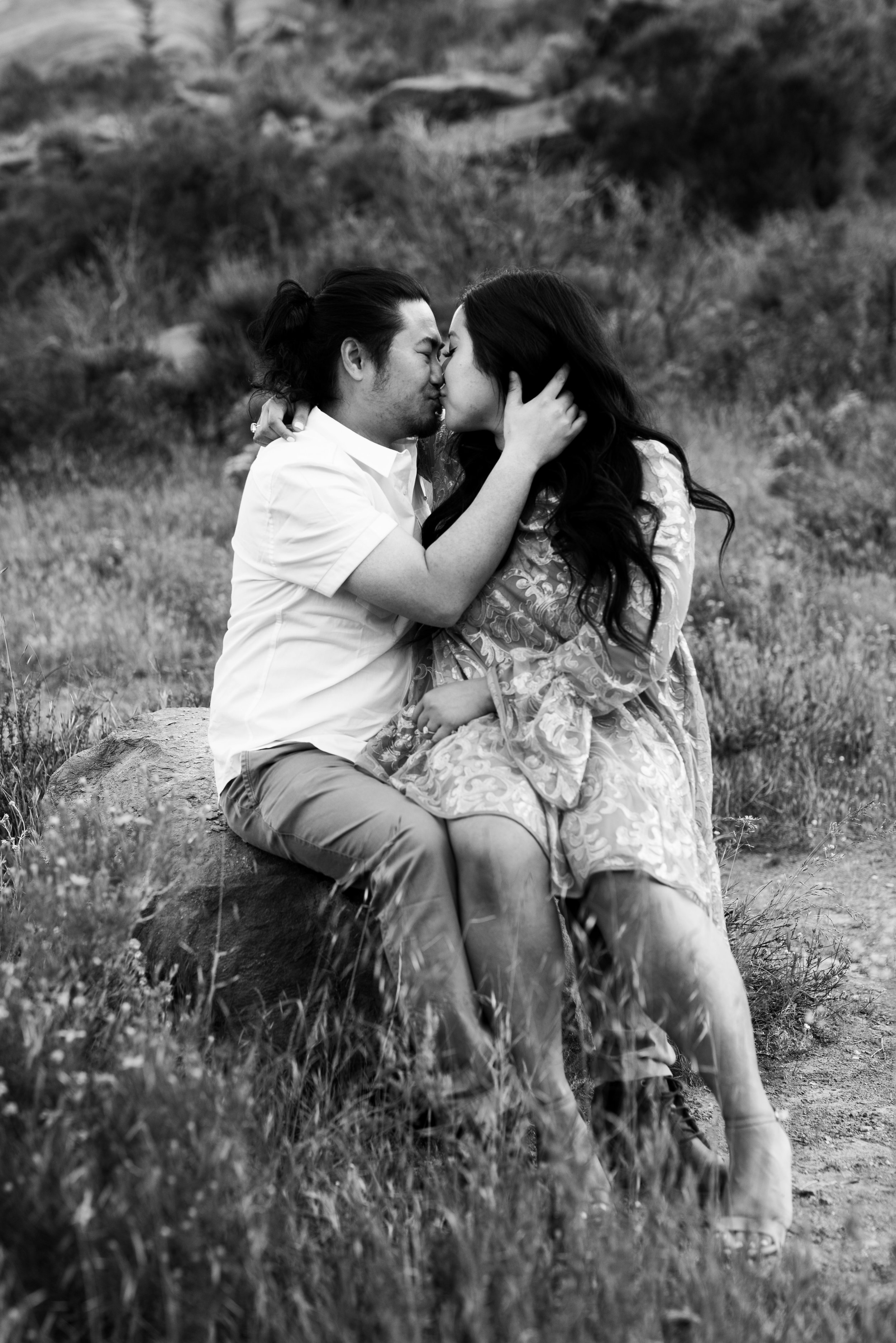 black and white photo of couple kissing at Vasquez Rocks | romantic, nostalgic photos by adventurous elopement photographer Kept Record | www.keptrecord.com