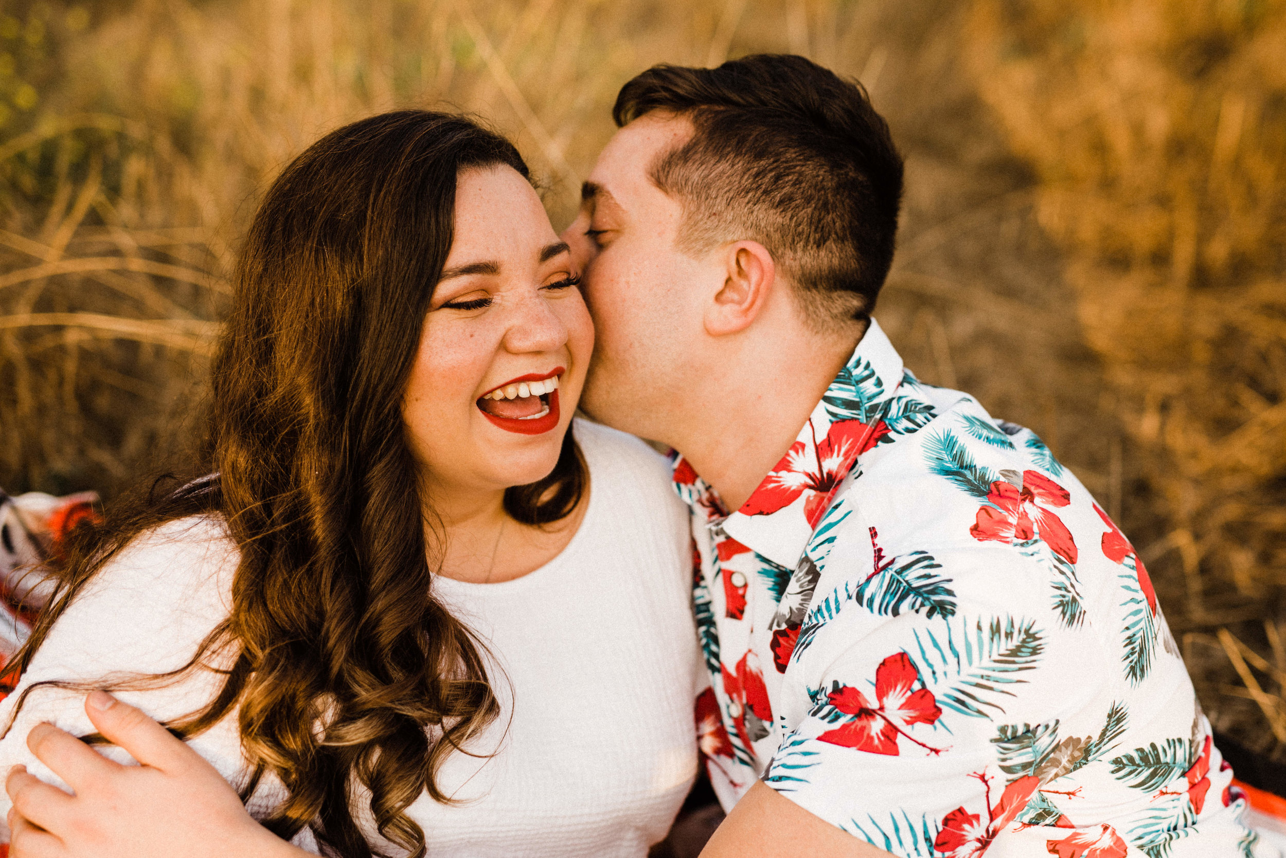 Engaged Couple laughing at Bronson Canyon